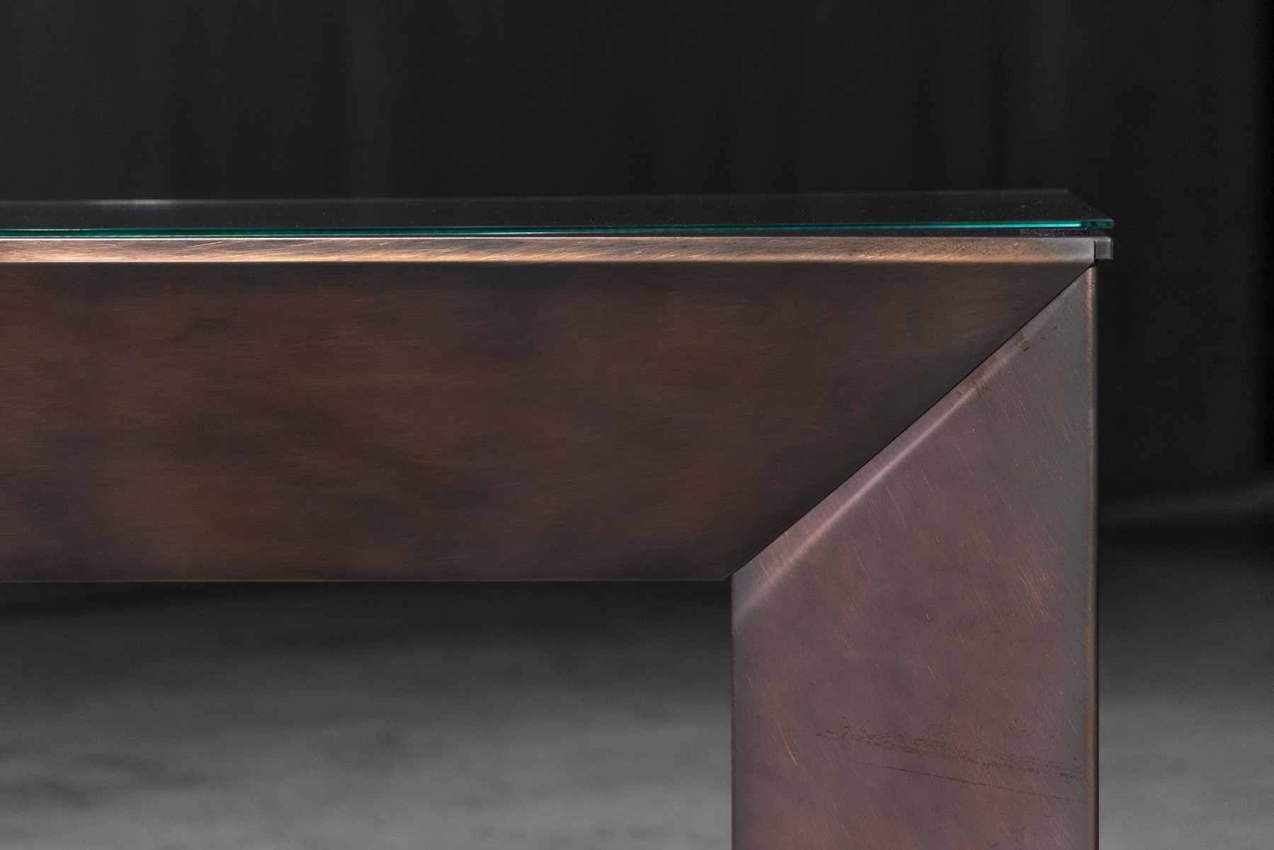 Patinated bronze console table with architectural presence