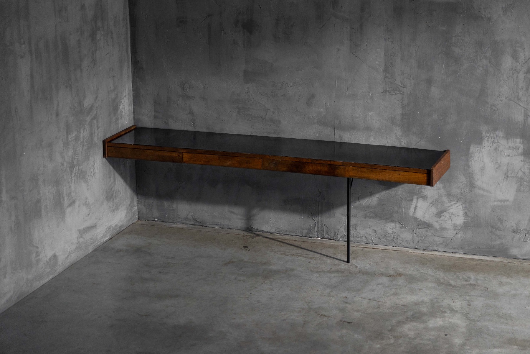 Floating effect modernist wall console with slender proportions