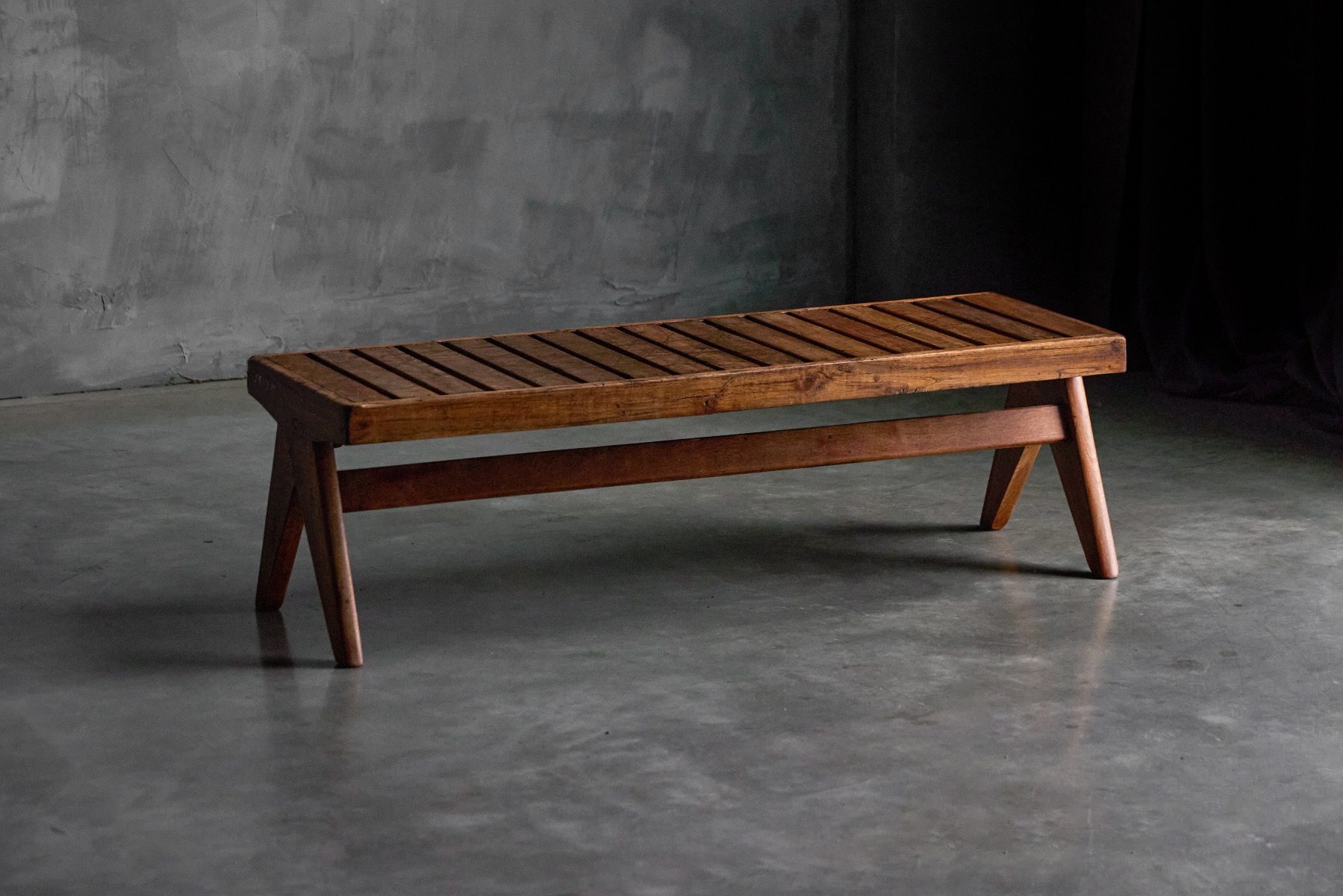 Teak slatted bench with architectural design by Pierre Jeanneret