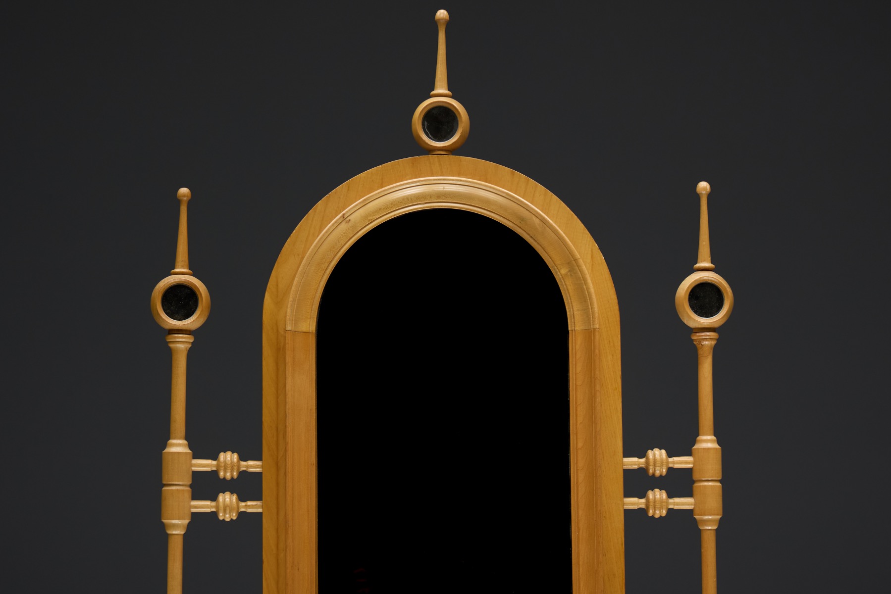 Vanity cabinet with paneled door design in architectural revival language