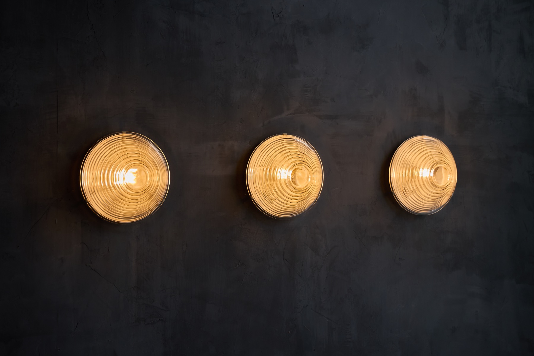Mid century Italian wall sconces in ribbed glass
