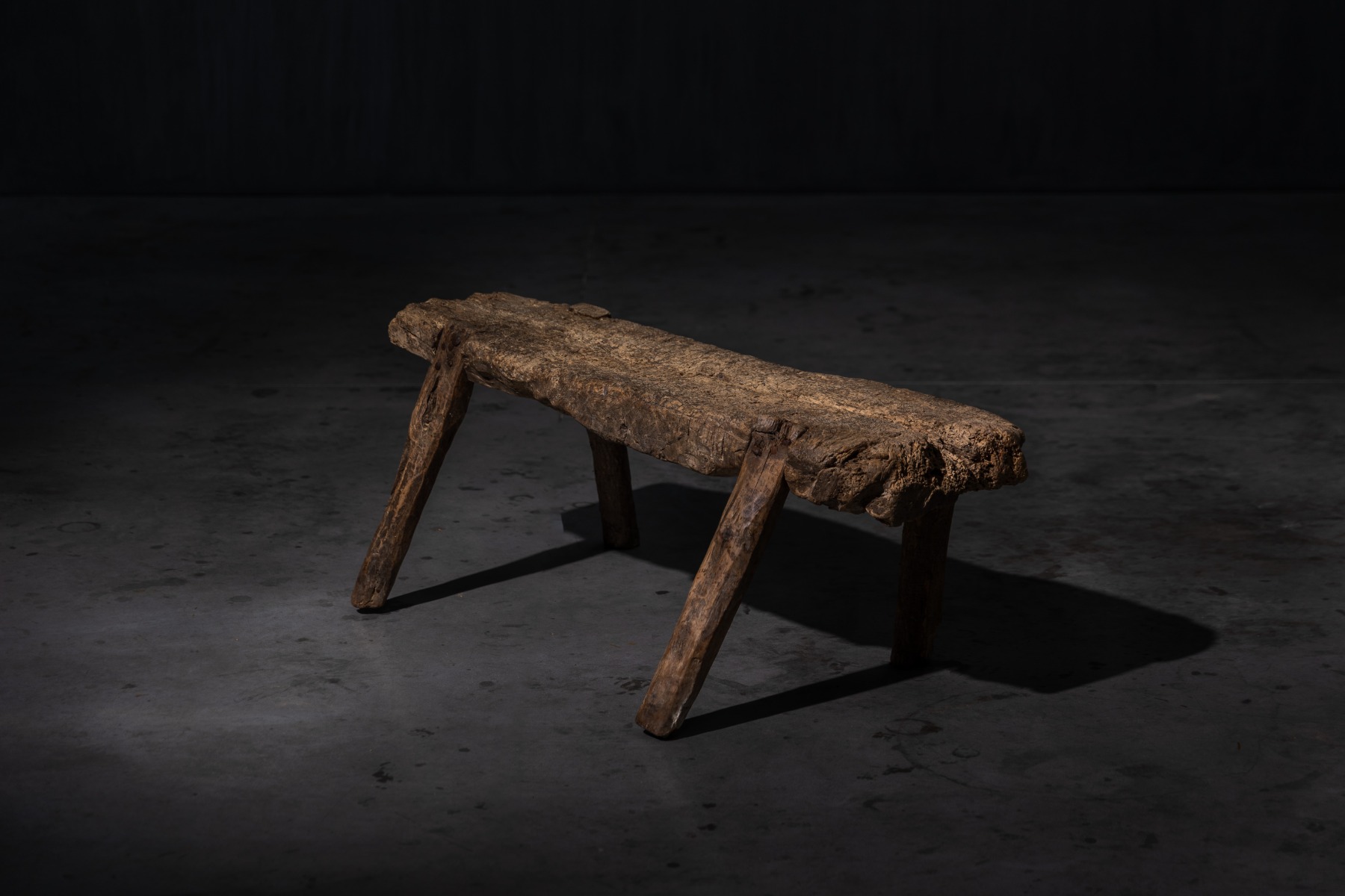 Rural vernacular bench carved in solid wood