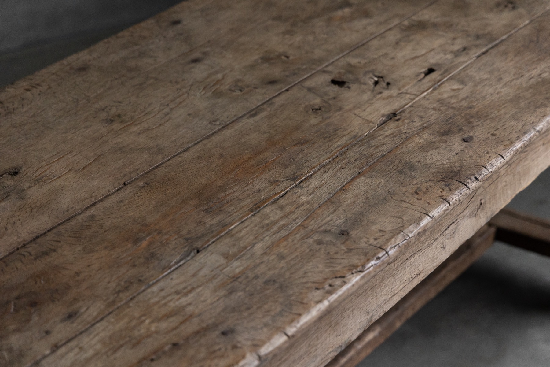Rural farmhouse dining table showing honest wear and age