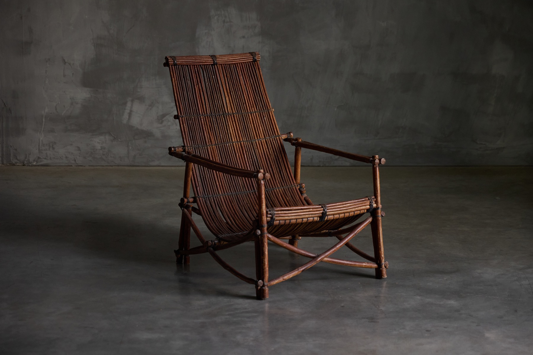 Rustic reclining chairs featuring handwoven wicker structure