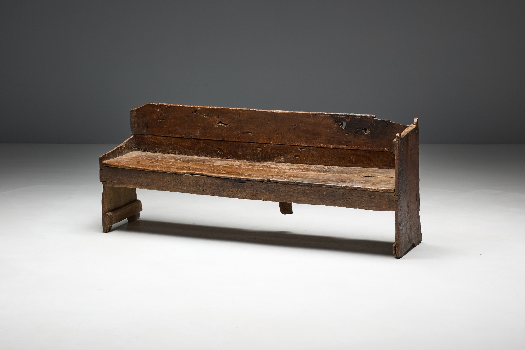 Primitive plank bench in solid wood