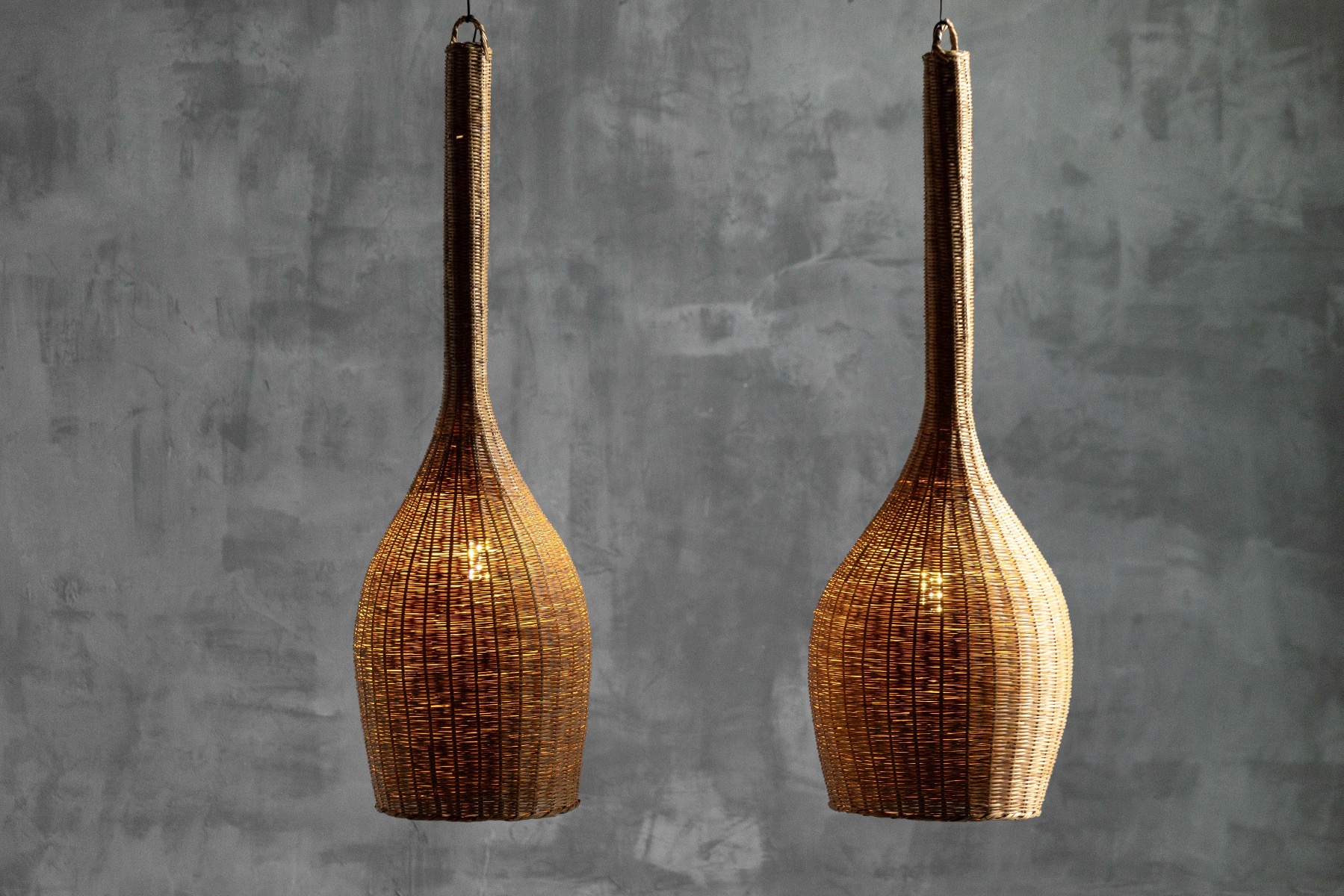 Sculptural mid century pendant lamp crafted in rattan