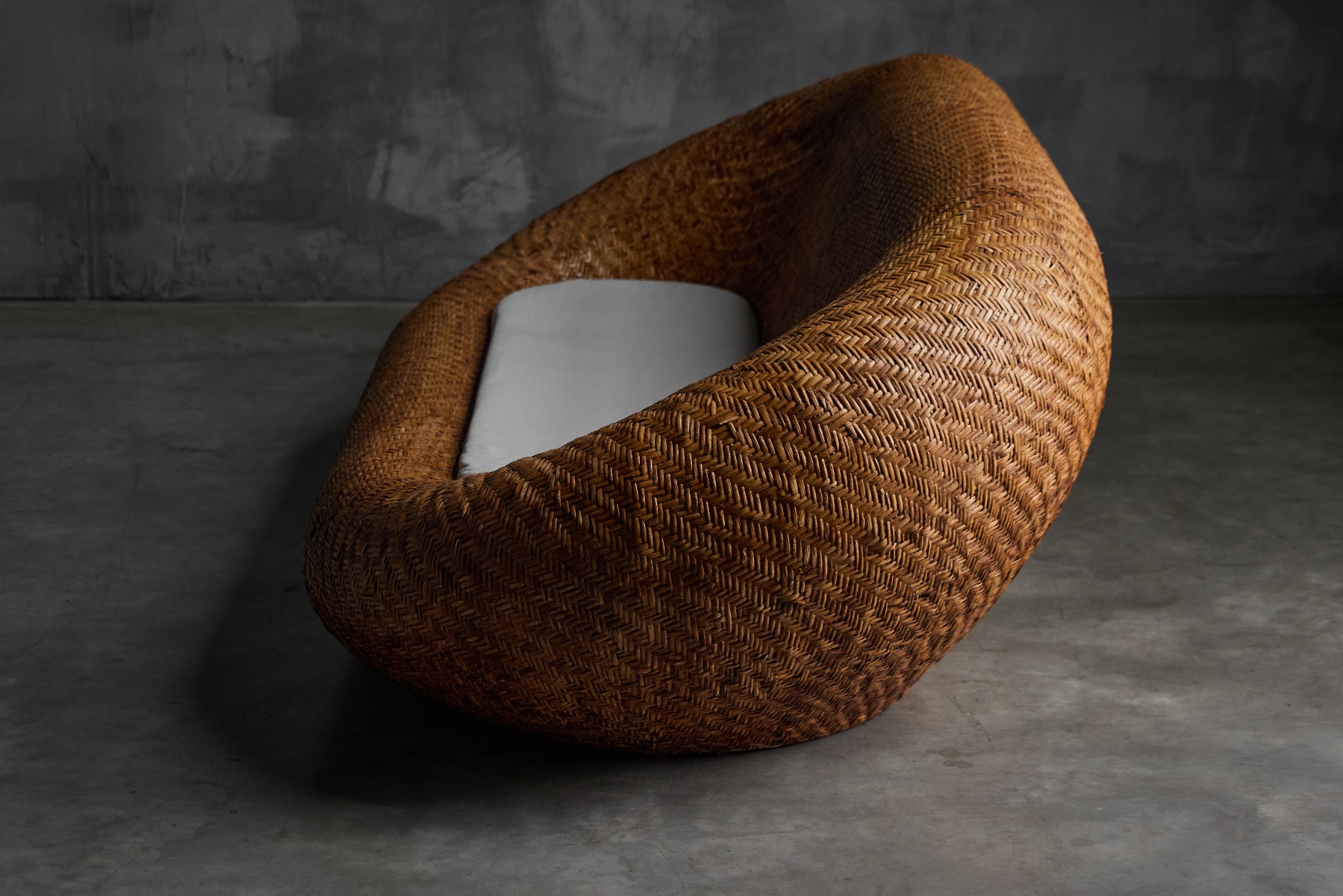 Sculptural mid century wicker sofa with organic form