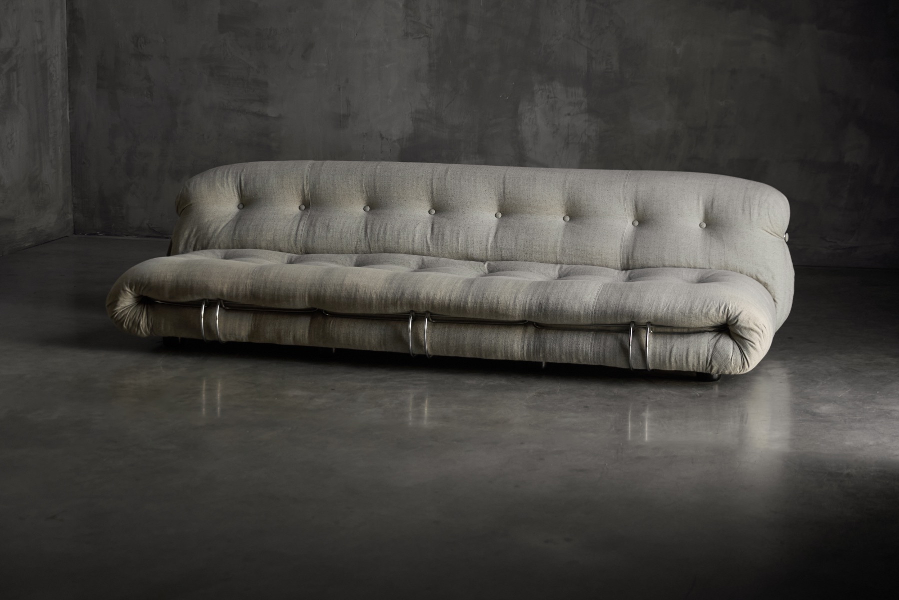 Soriana sofa by Cassina featuring signature metal clamps