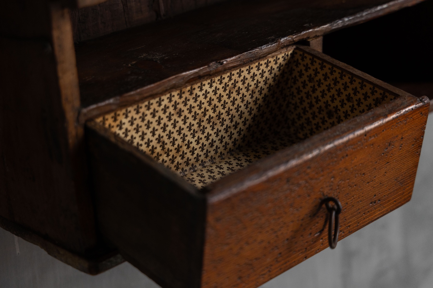 Utilitarian vernacular wall cabinet with honest wear