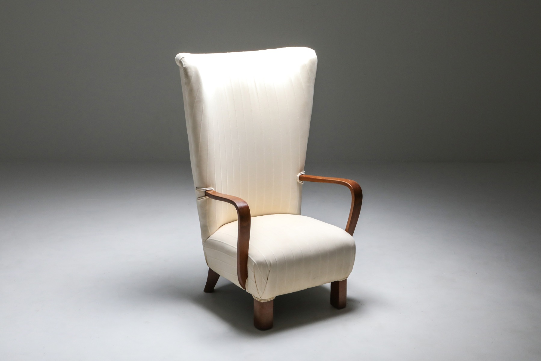 Collectible white wingback chair with ottoman from the 1950s