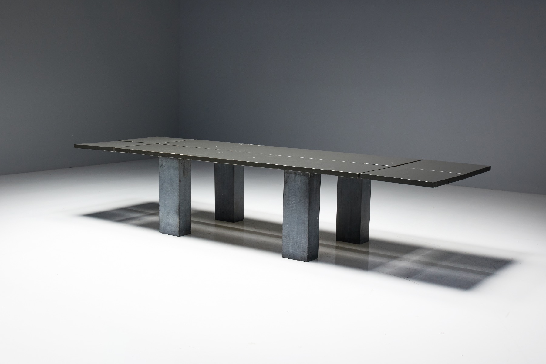 Architectural brutalist table with stone base