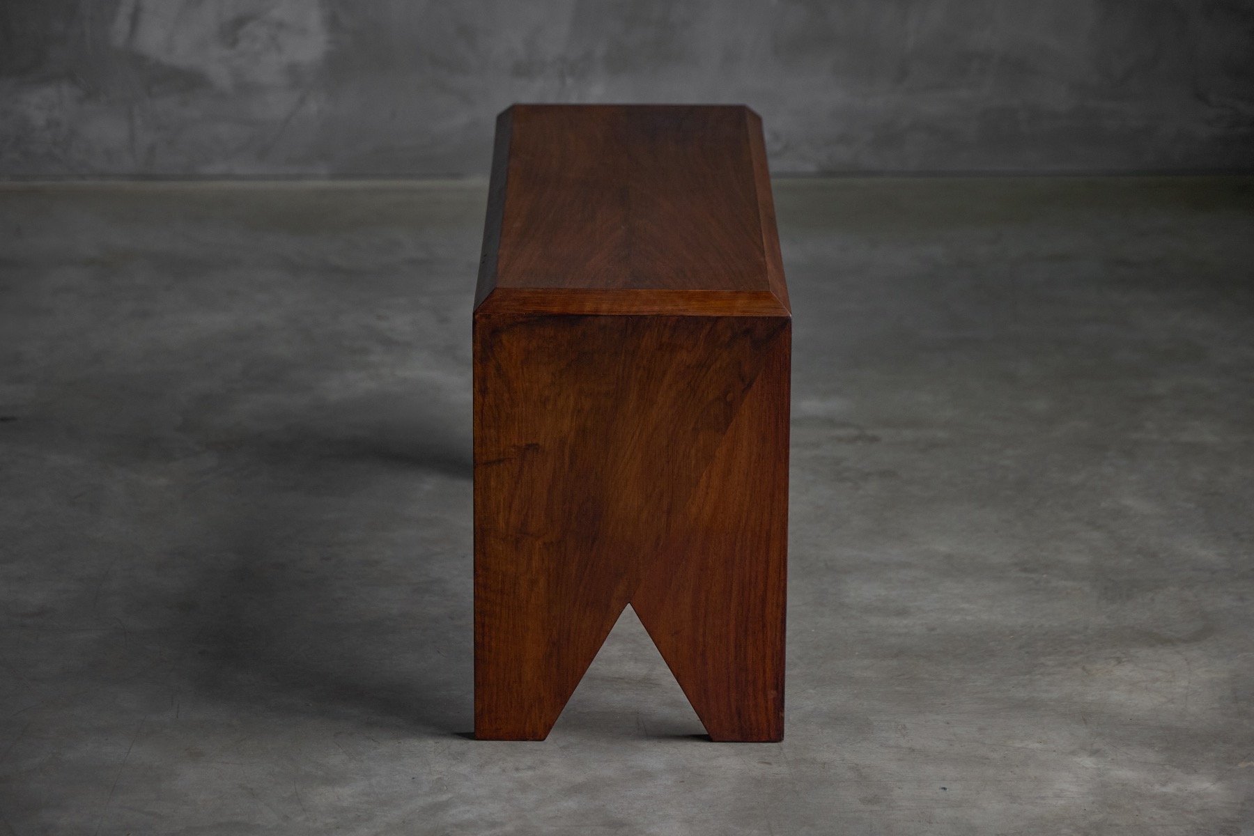 Architectural walnut bench with refined lines