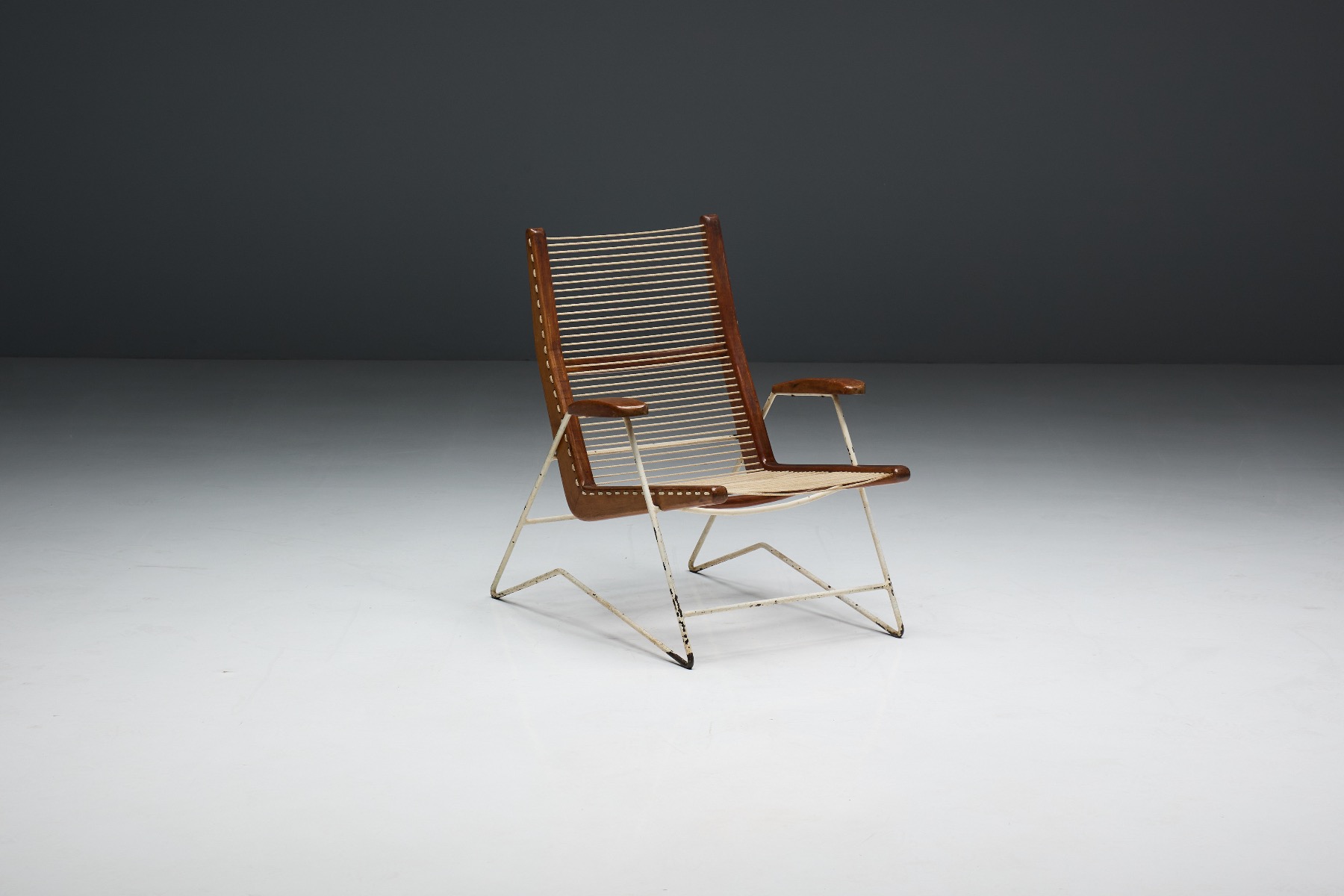 Architectural lounge chair with woven string seat
