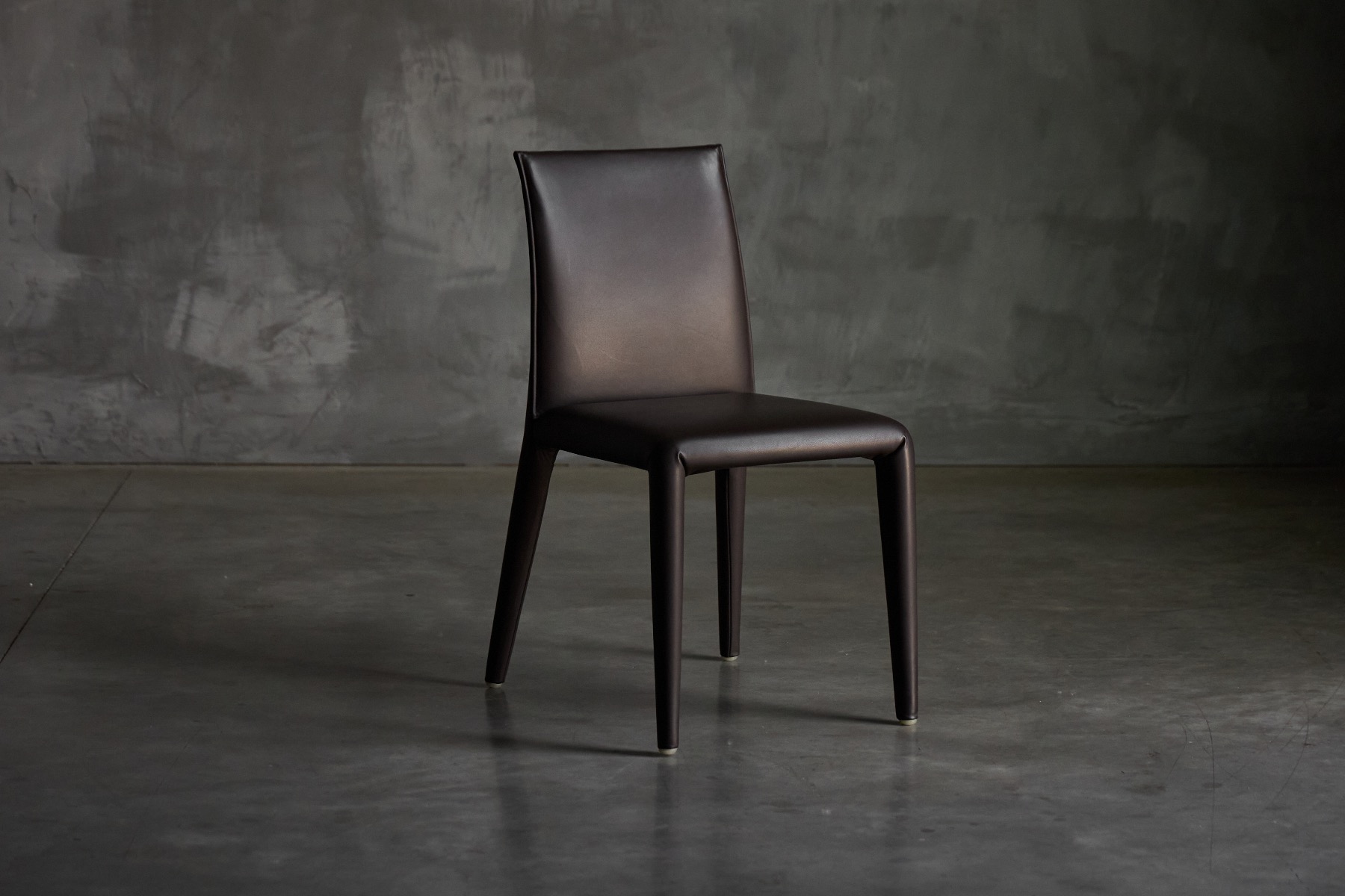 Architectural dining chair designed by Mario Bellini