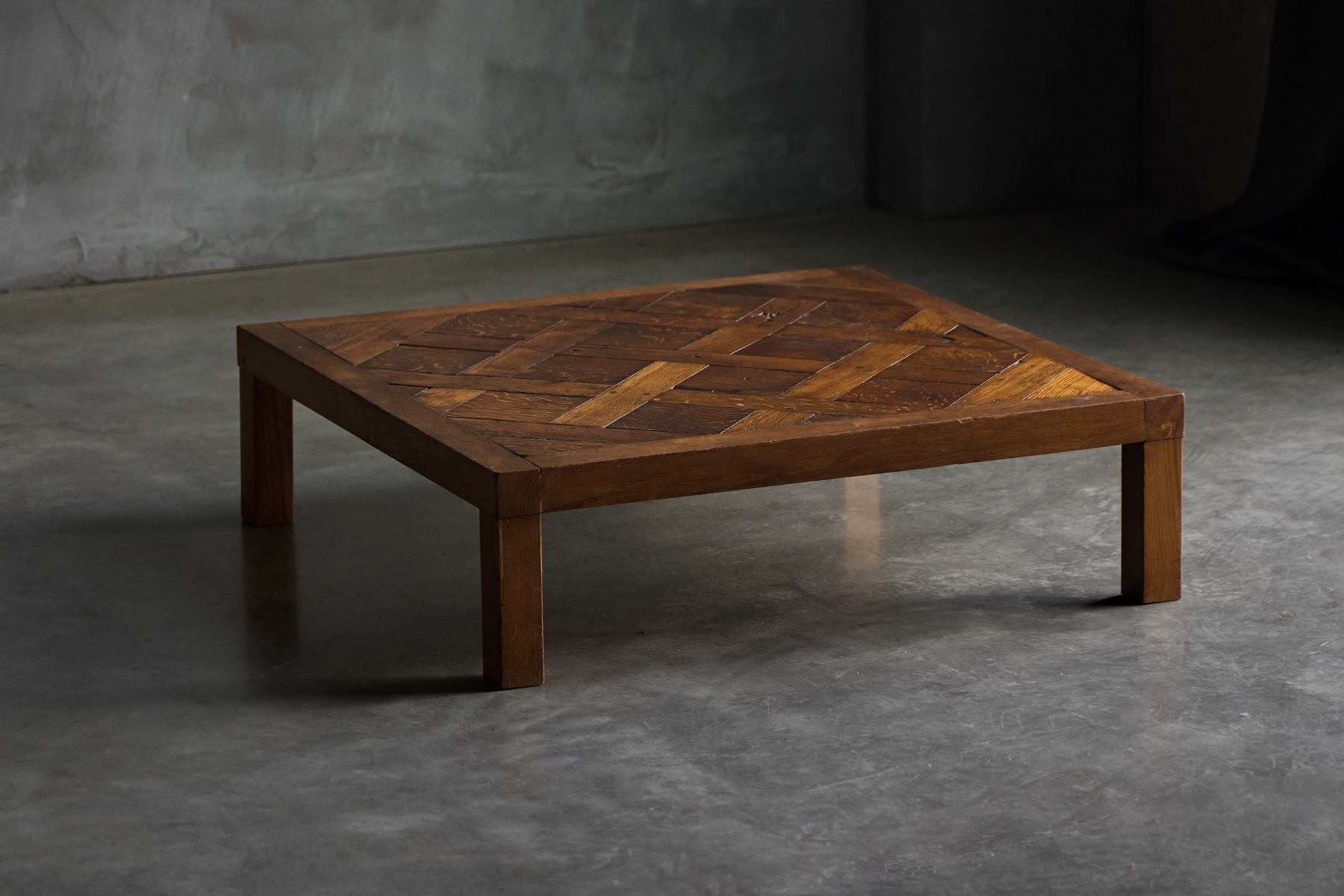 Geometric brutalist coffee table featuring parquet pattern