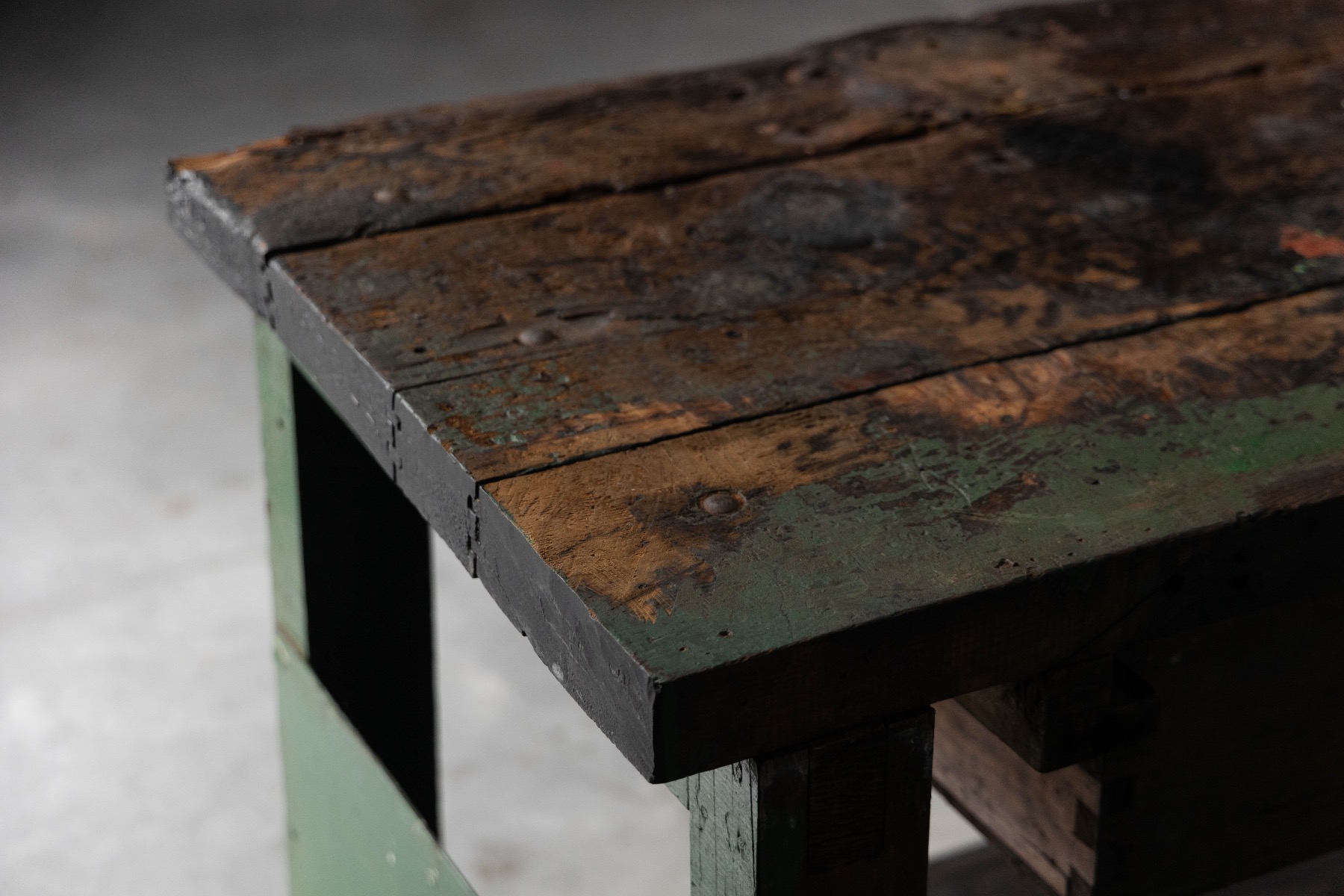 Heavy duty industrial workbench with aged patina