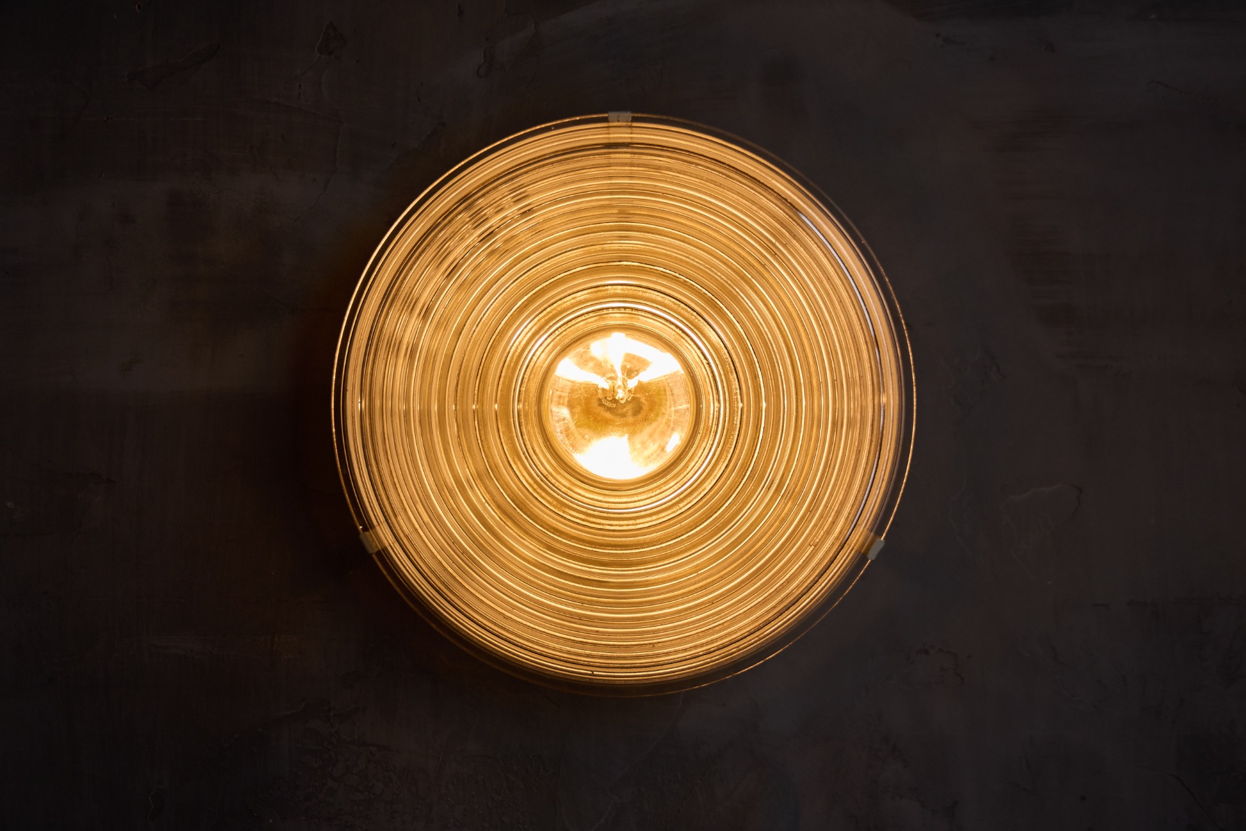 Ribbed glass wall lighting reflecting Italian modern design