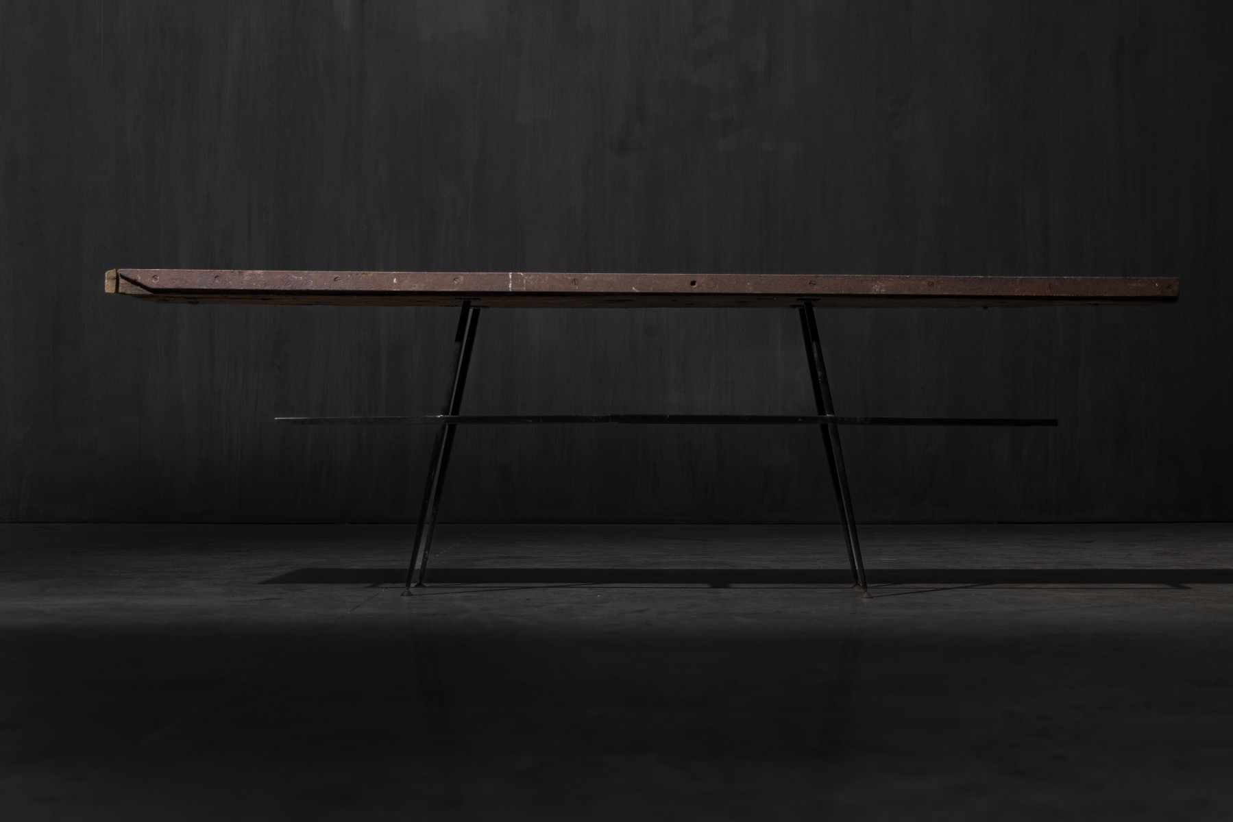 Architectural industrial console table with textured surface