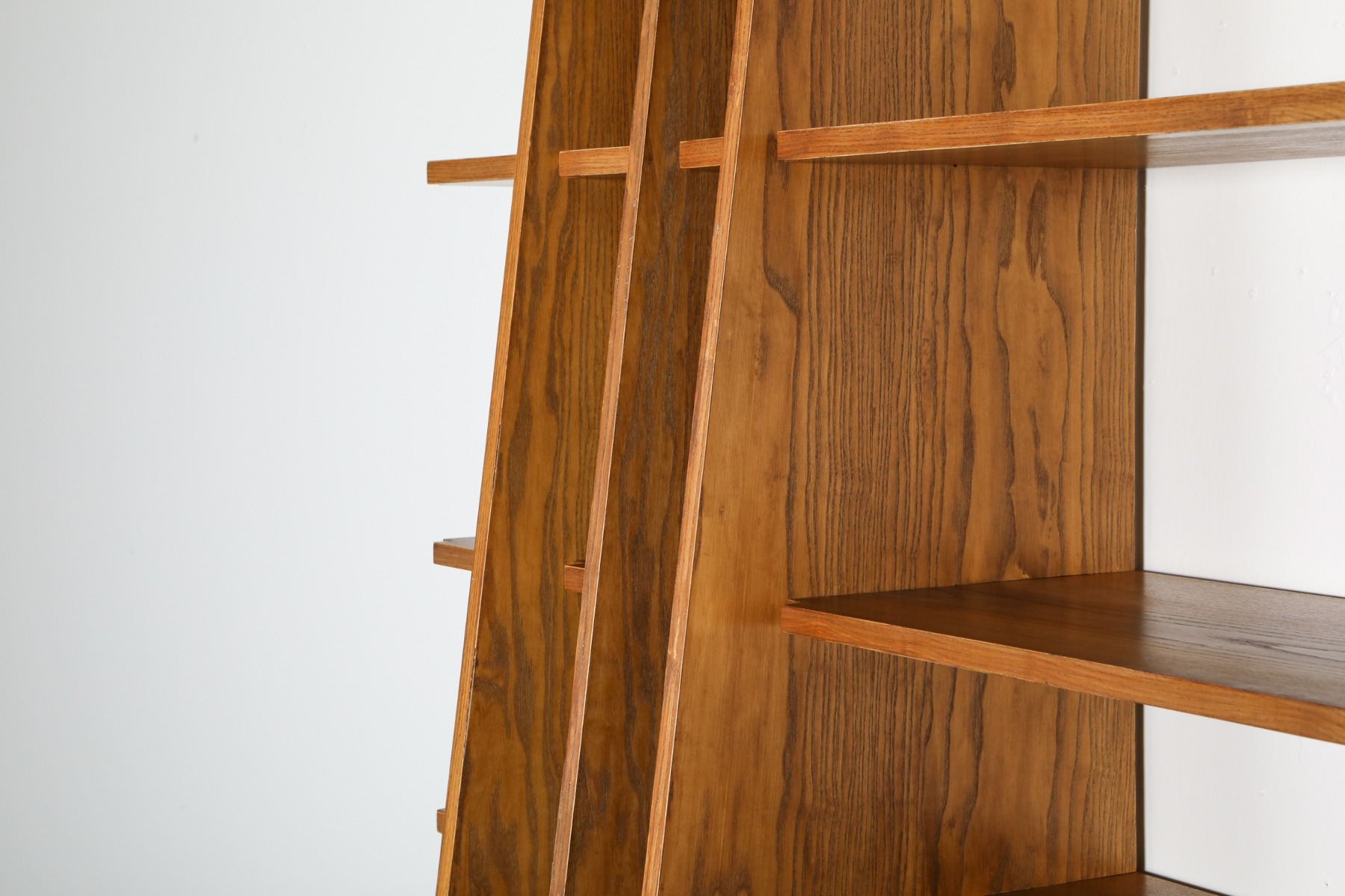 Modernist walnut shelving unit in architectural design