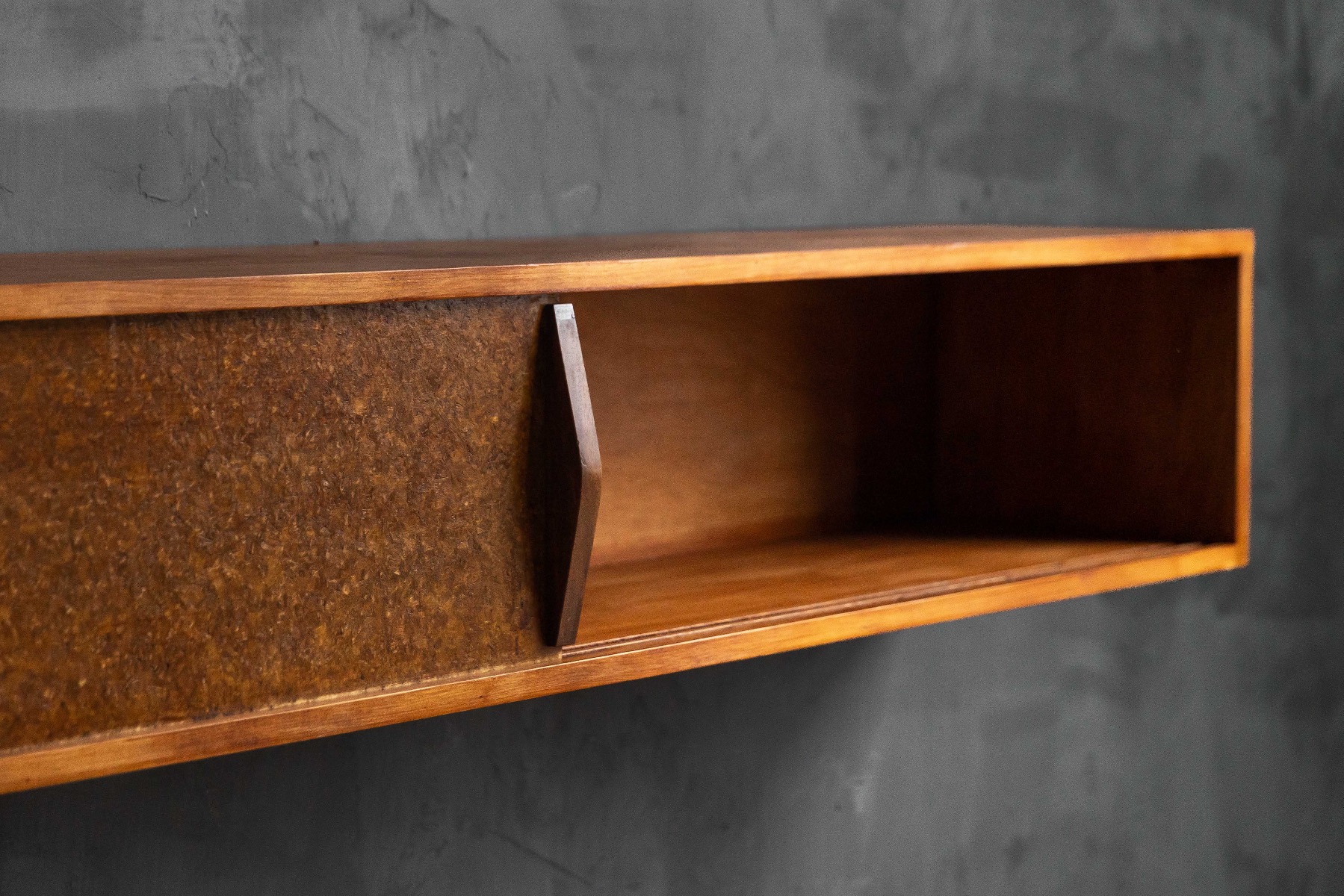 Wall mounted shelf reflecting French modernist design by Perriand and Prouvé