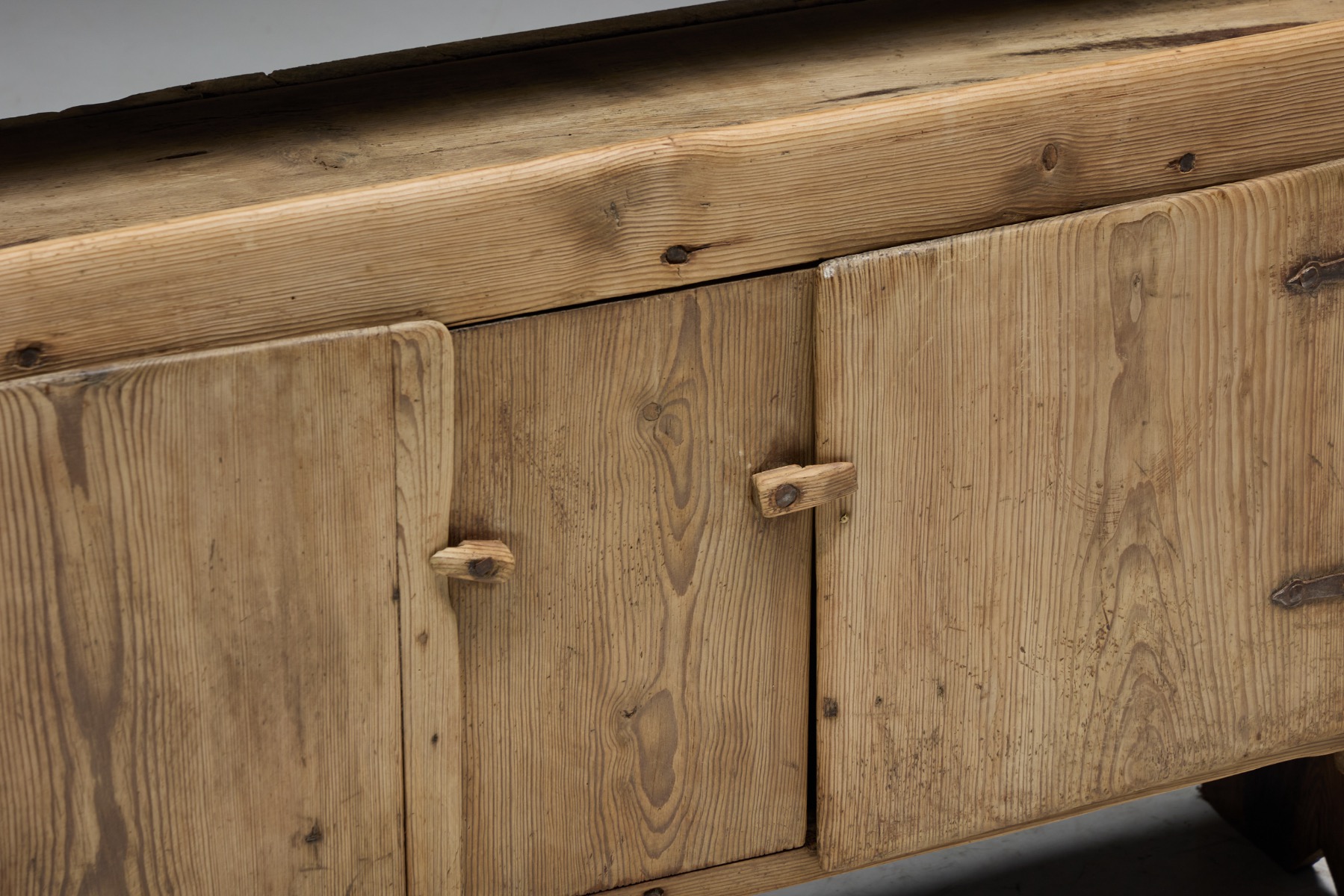 Handcrafted primitive cabinet reflecting rural 19th century furniture