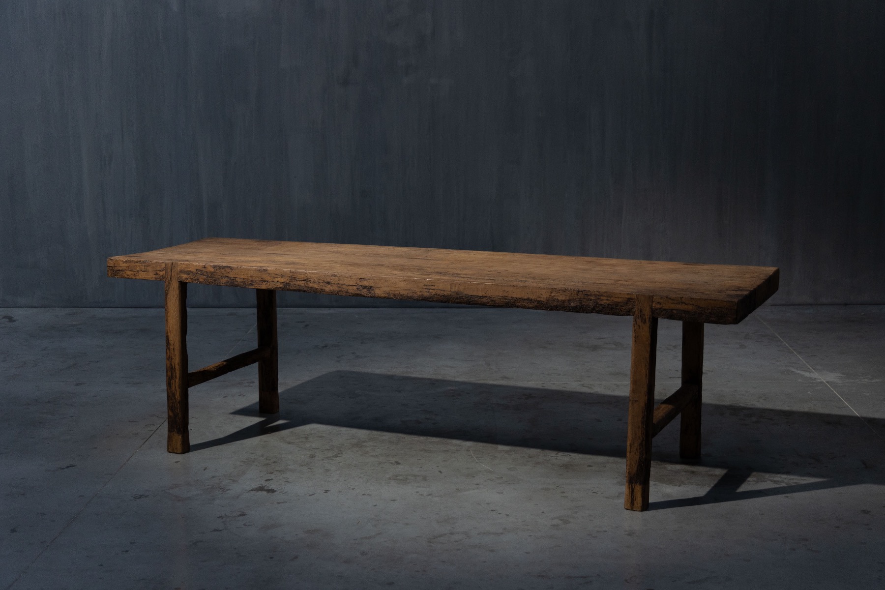 Handcrafted rustic dining table with robust legs