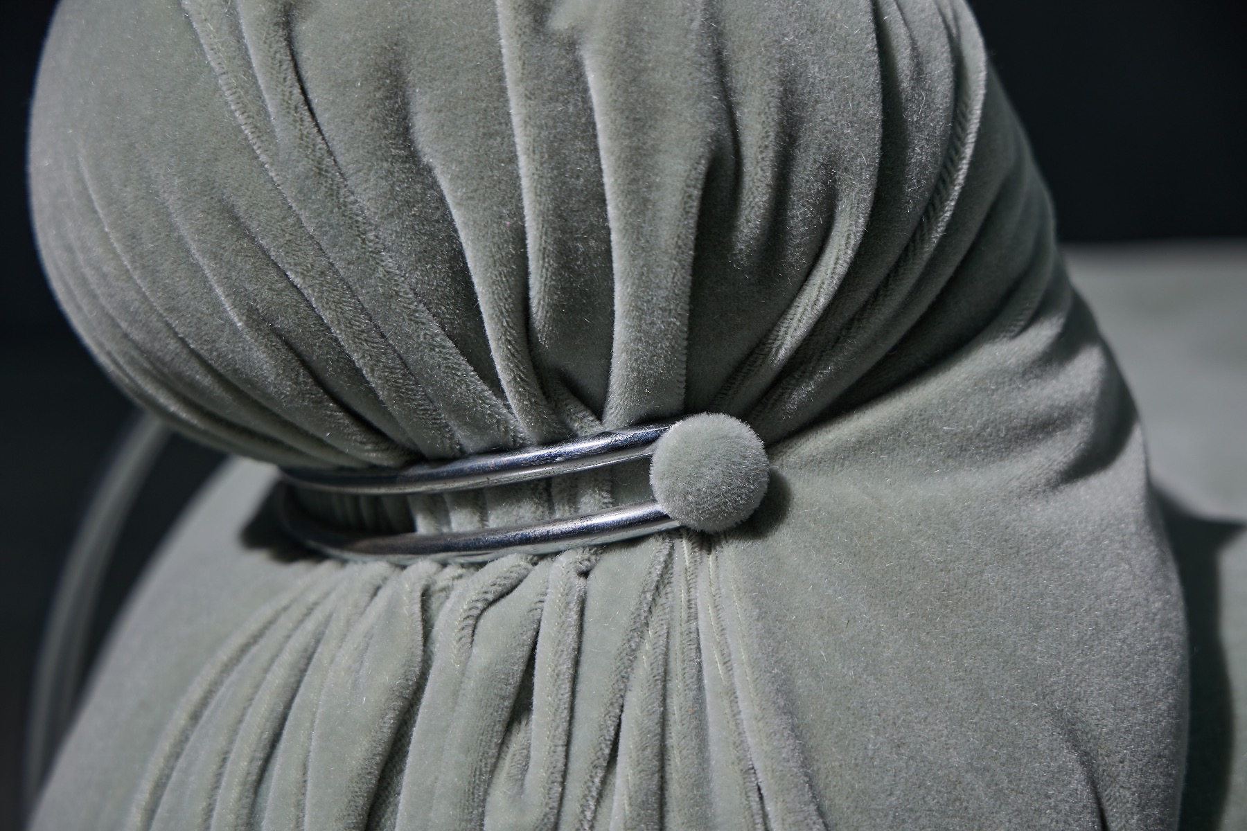 Iconic Soriana sofa with characteristic metal clamp detail