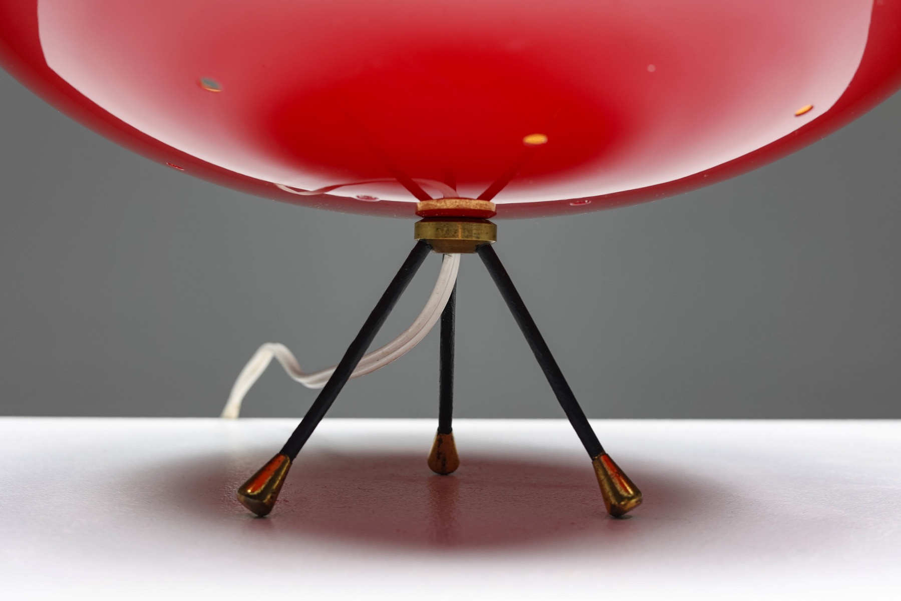 Sleek space age lamp in red and black design