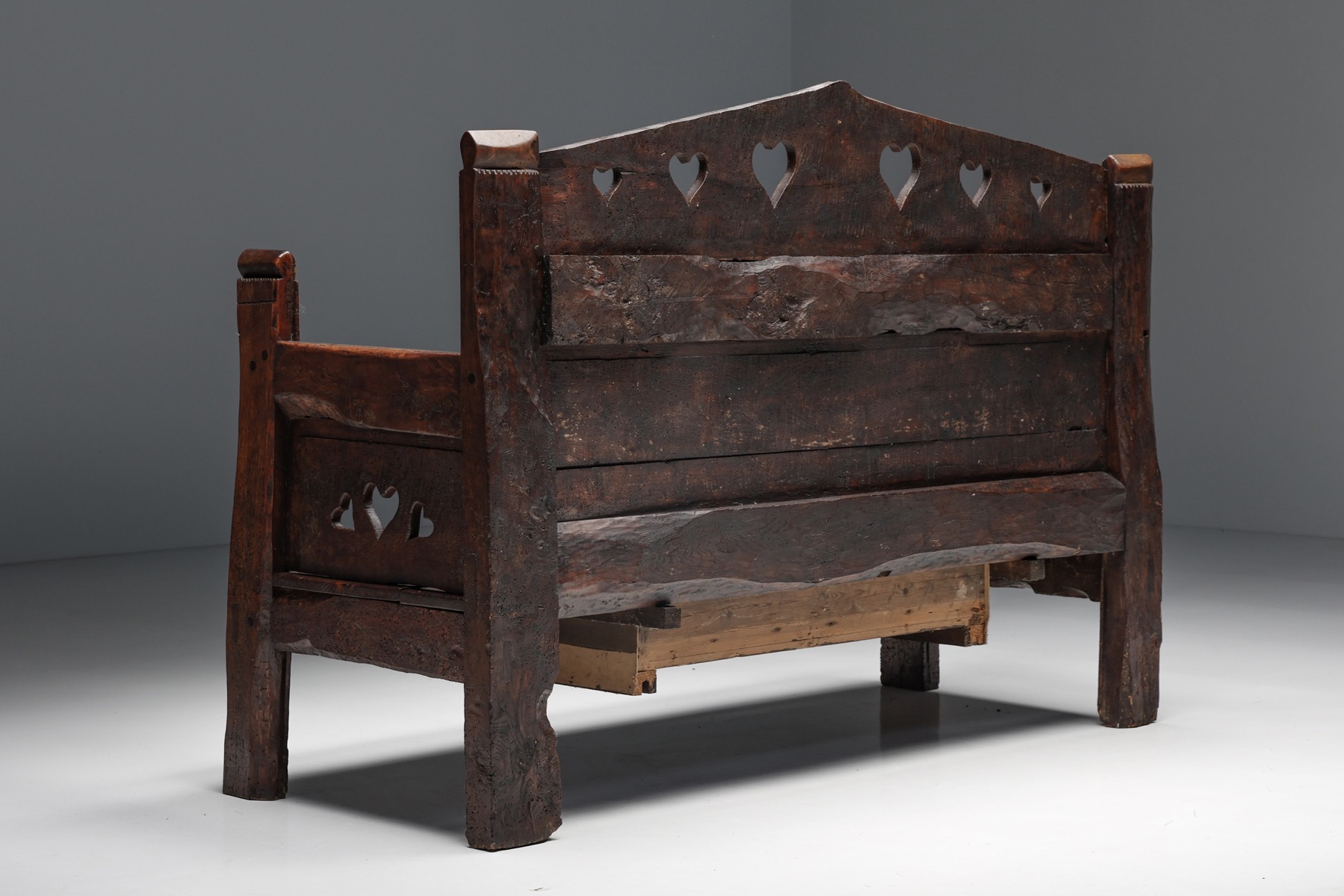 Traditional carved bench with hidden space in wood