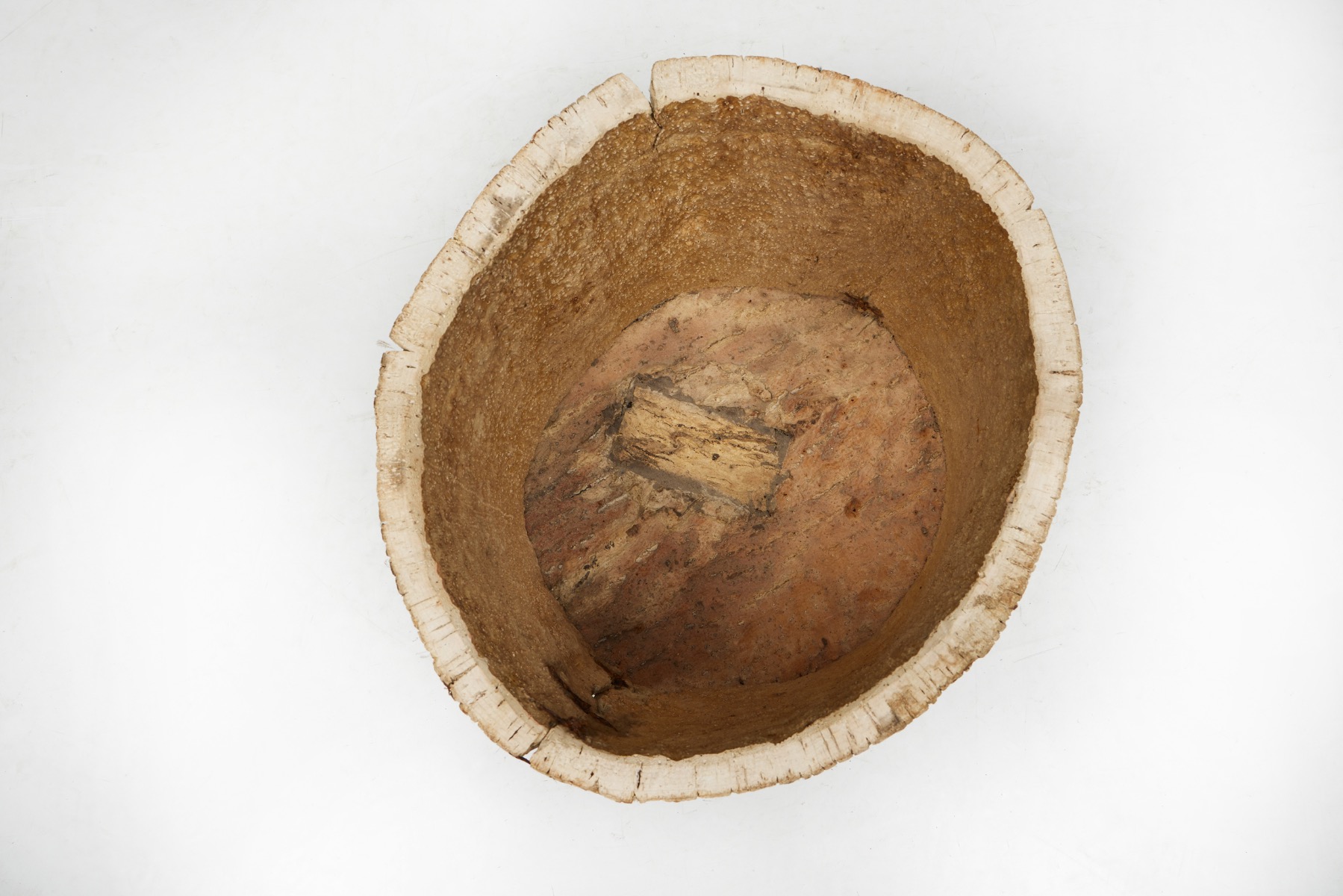 Traditional wood carved basket in tree trunk form