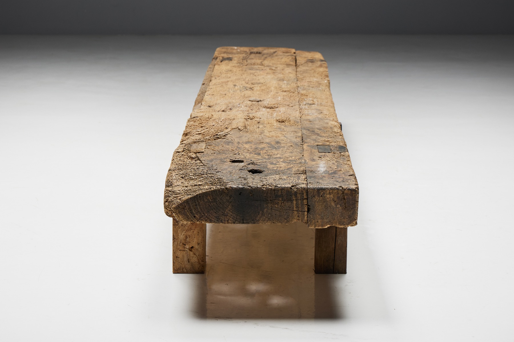 Traditional wooden bench in primitive style