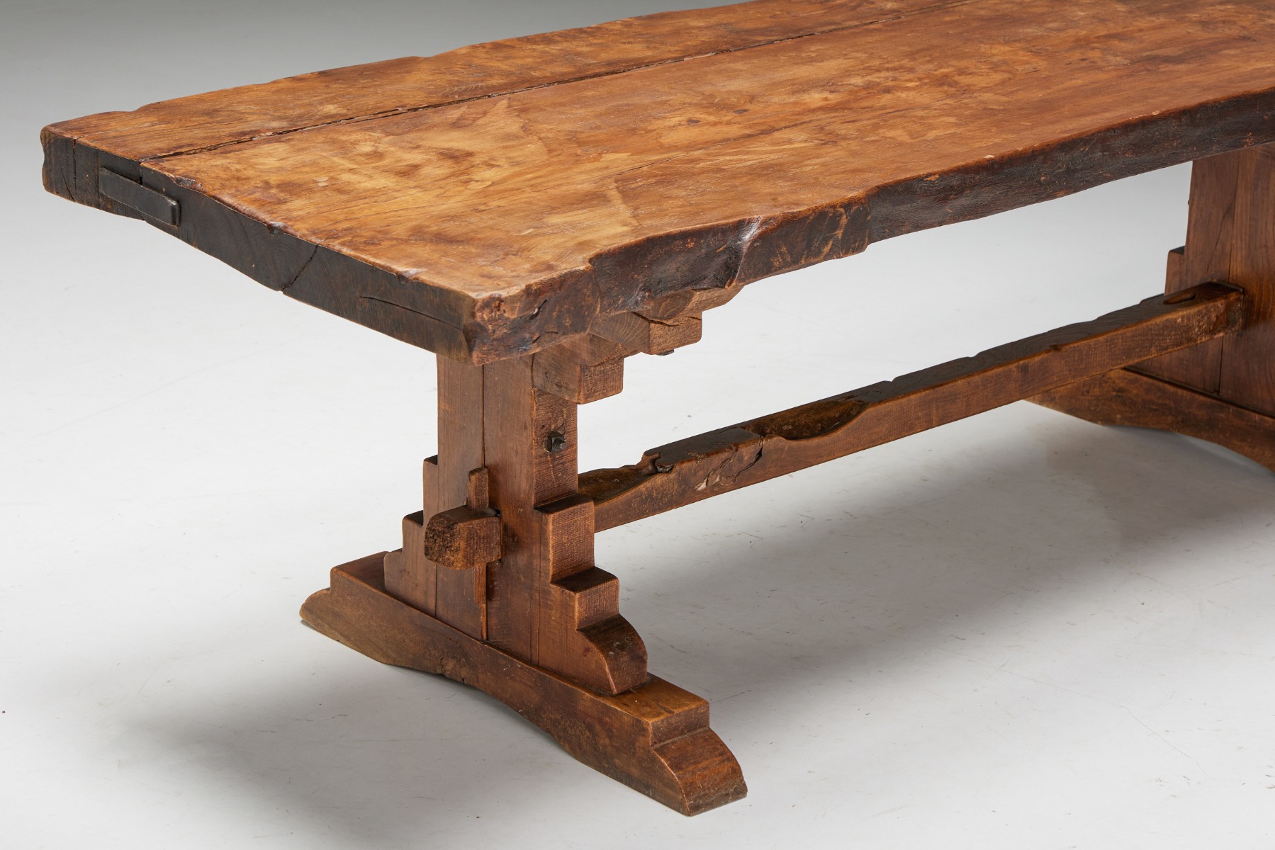 Traditional wooden dining table in primitive style