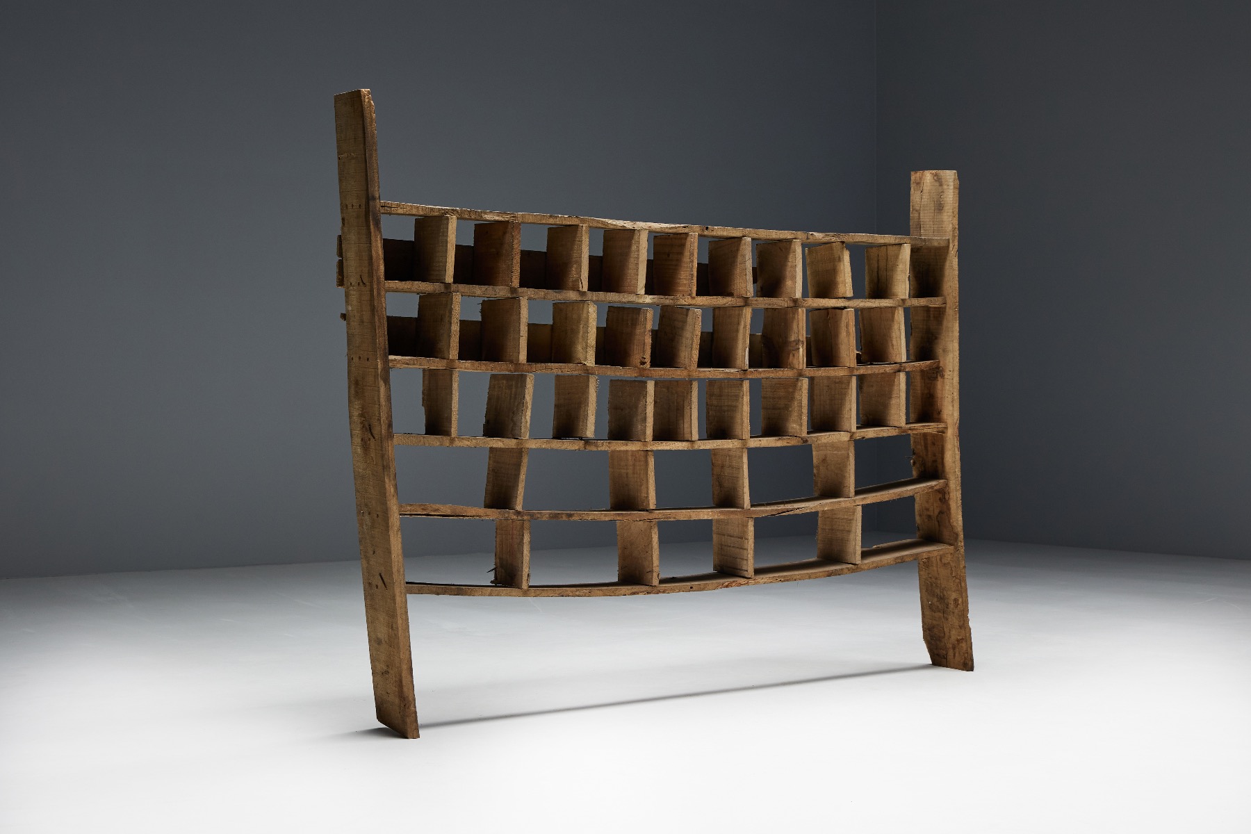 Traditional wooden shelving unit in primitive style