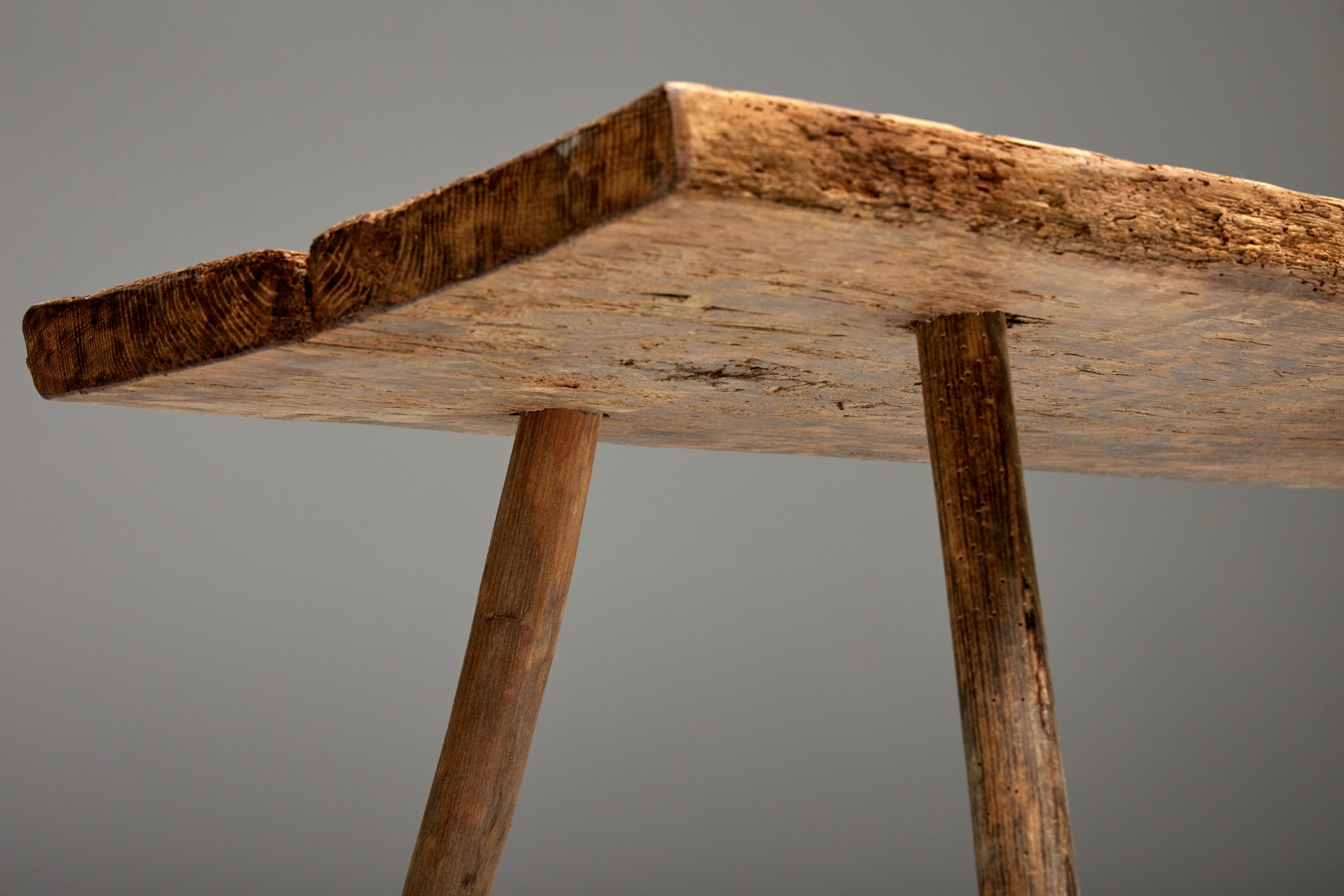 Traditional wooden side table in primitive style