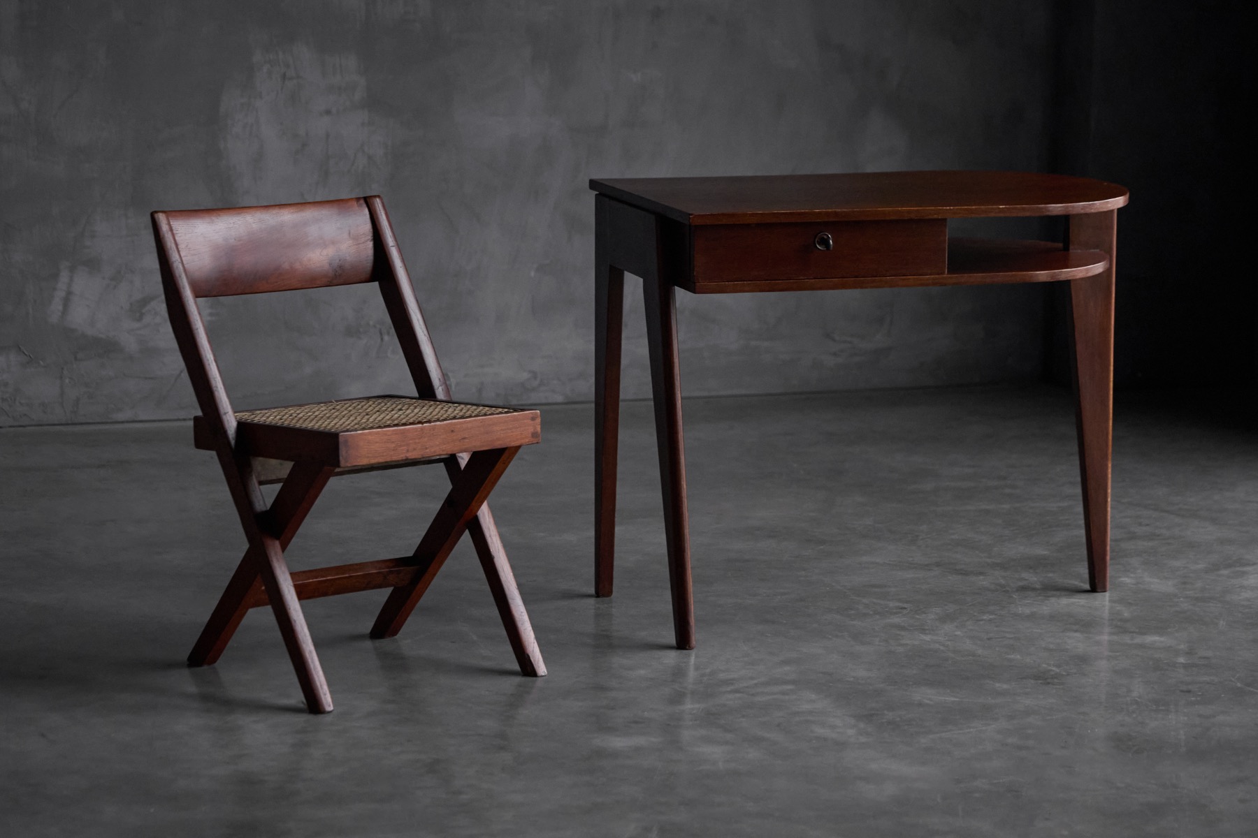 Tripod base desk by Jacques Adnet exemplifying French modernism