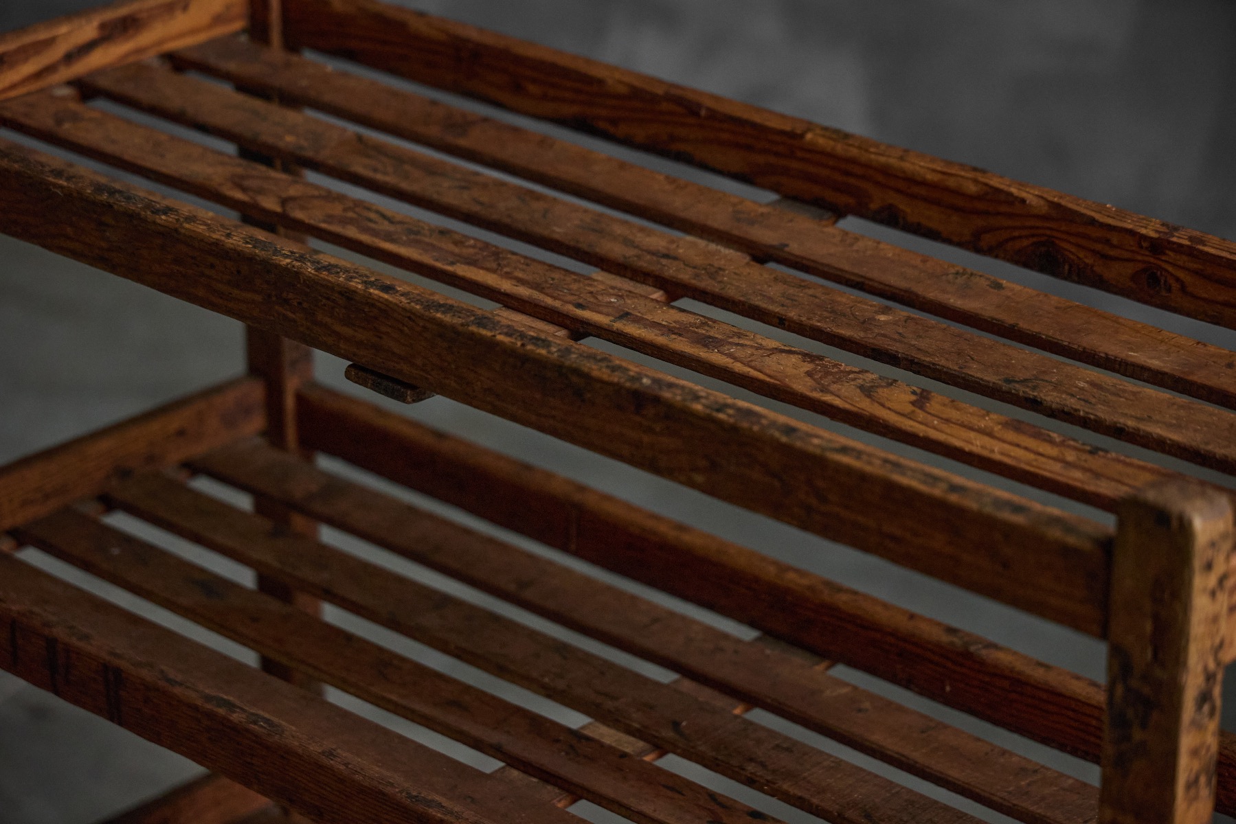 Utilitarian bakery rack with folk art construction