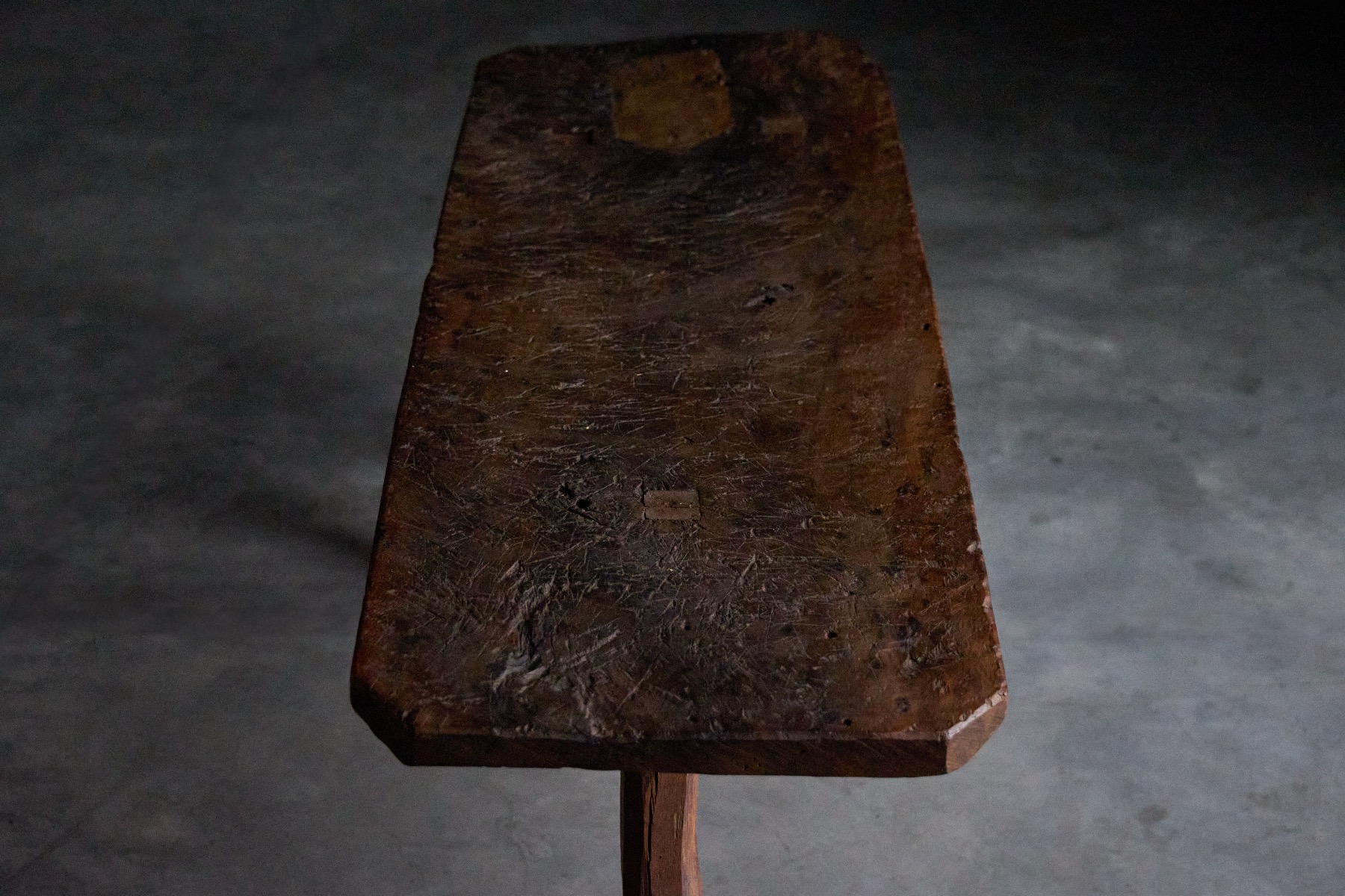 Weathered brutalist wooden tripod table