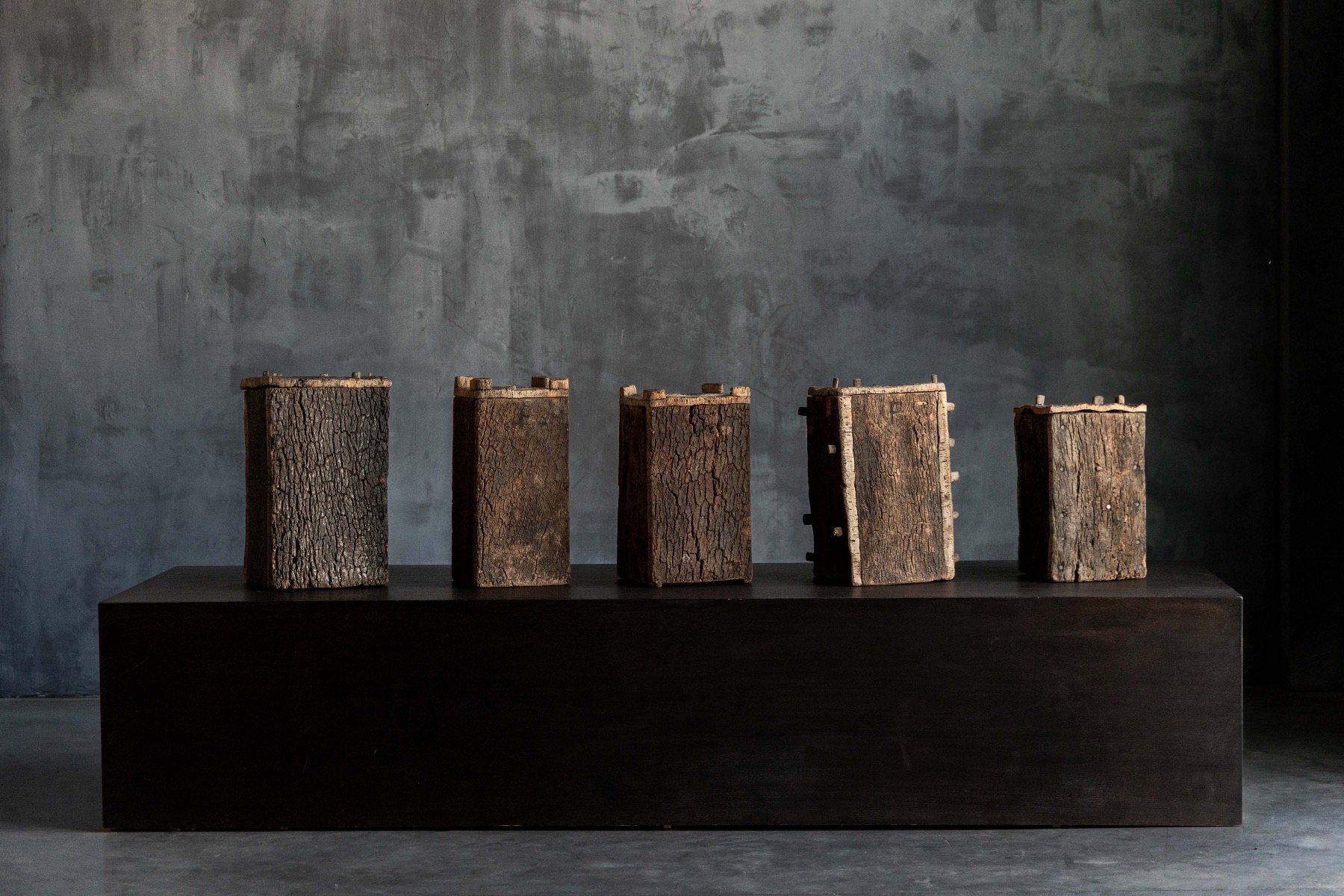 Timeworn wooden log hives from the 19th century