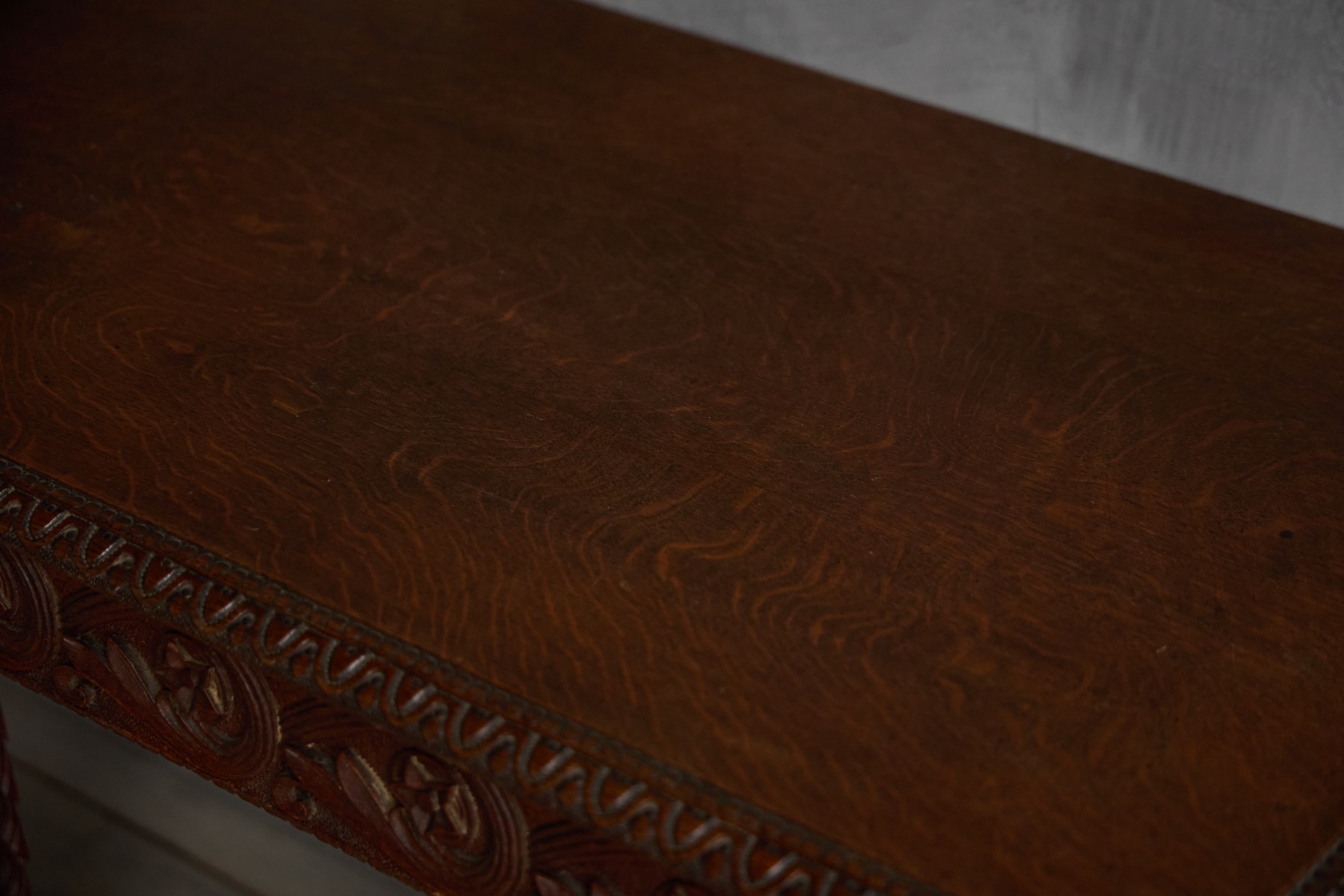 Ornate antique console table crafted in hand carved wood