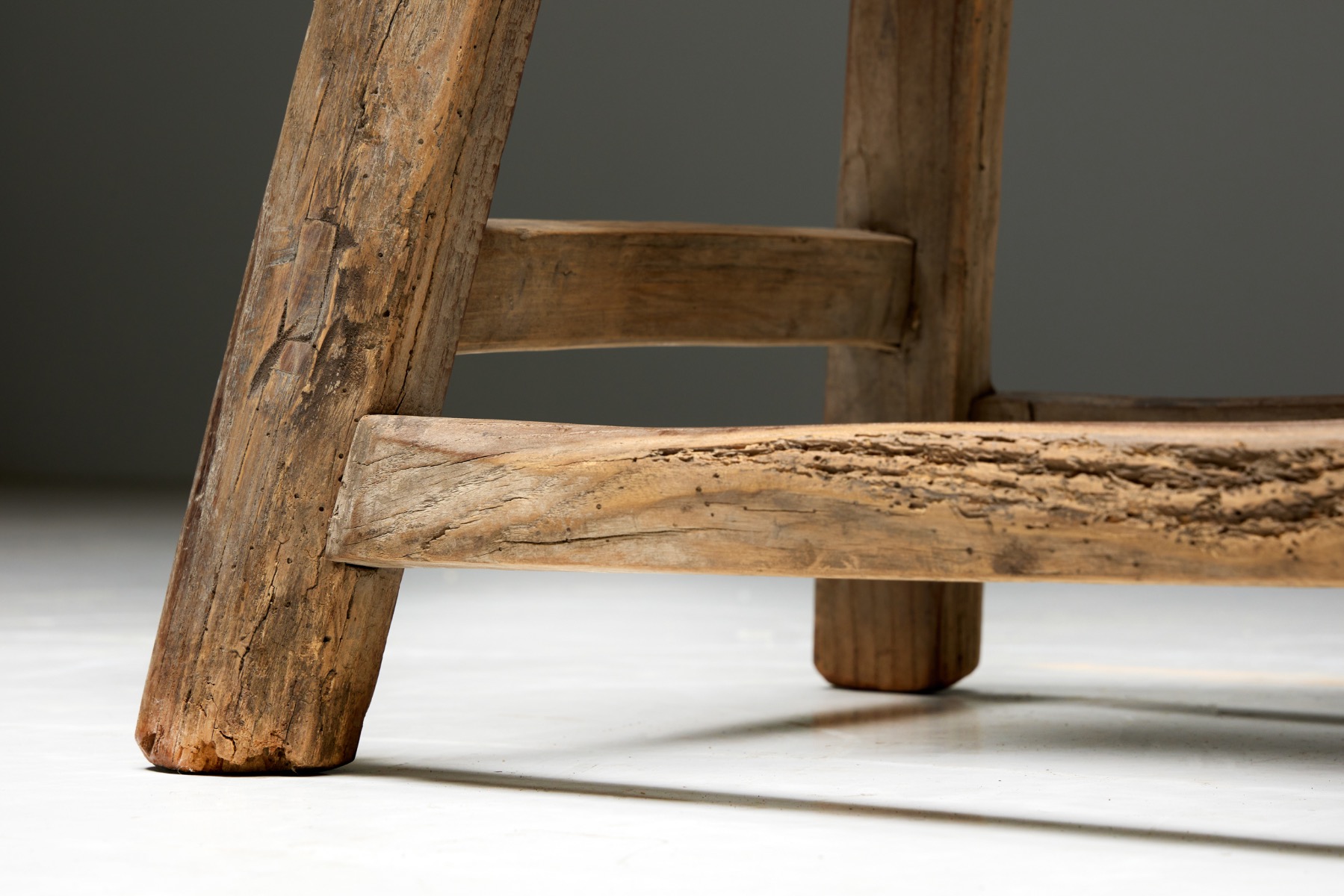 Antique rural stool in travail populaire wood