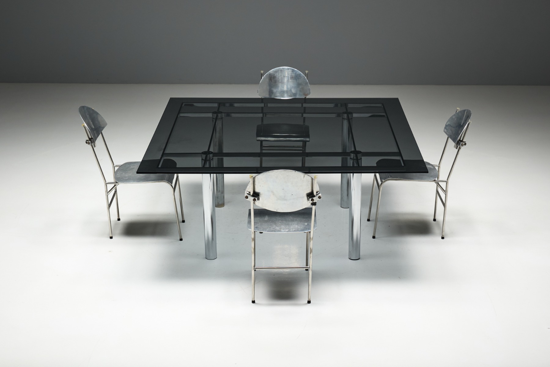 Architectural chrome dining table by Tobia Scarpa design