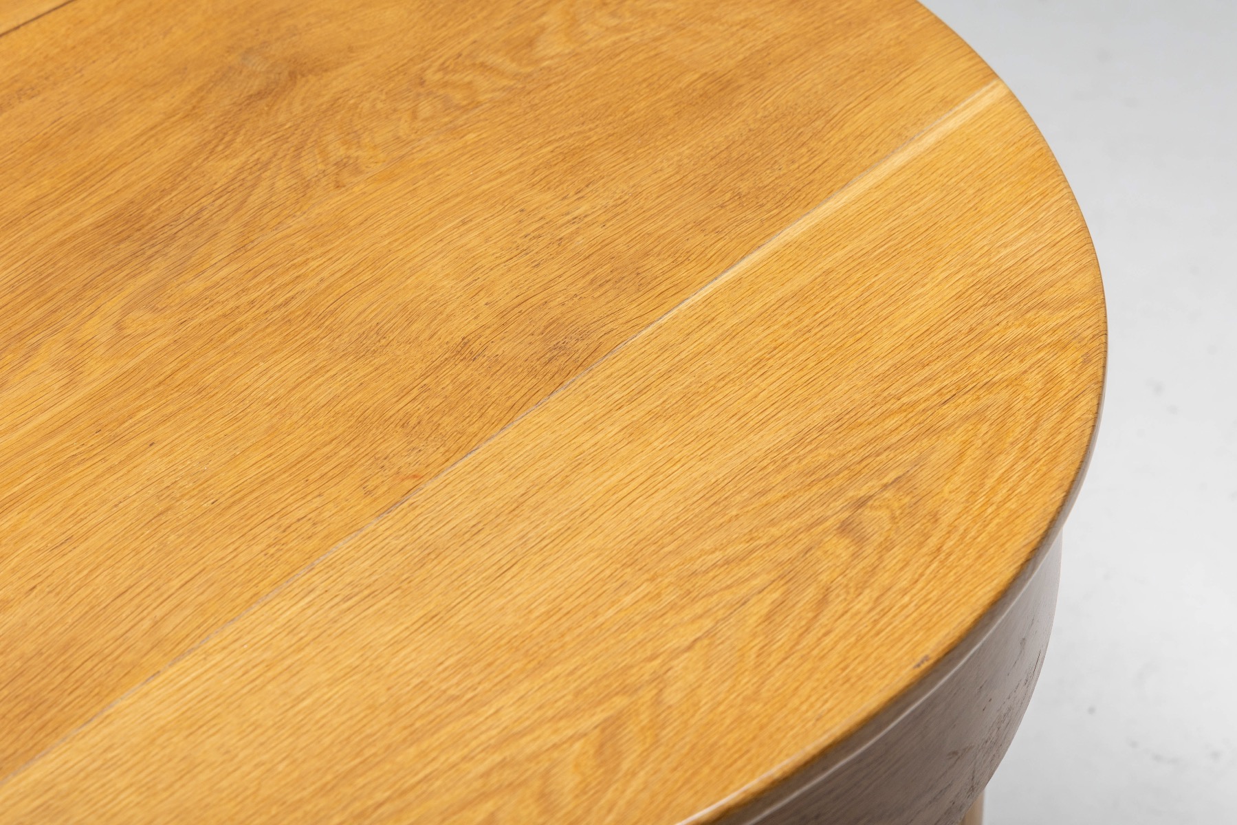 Architectural oval oak dining table in rationalist design