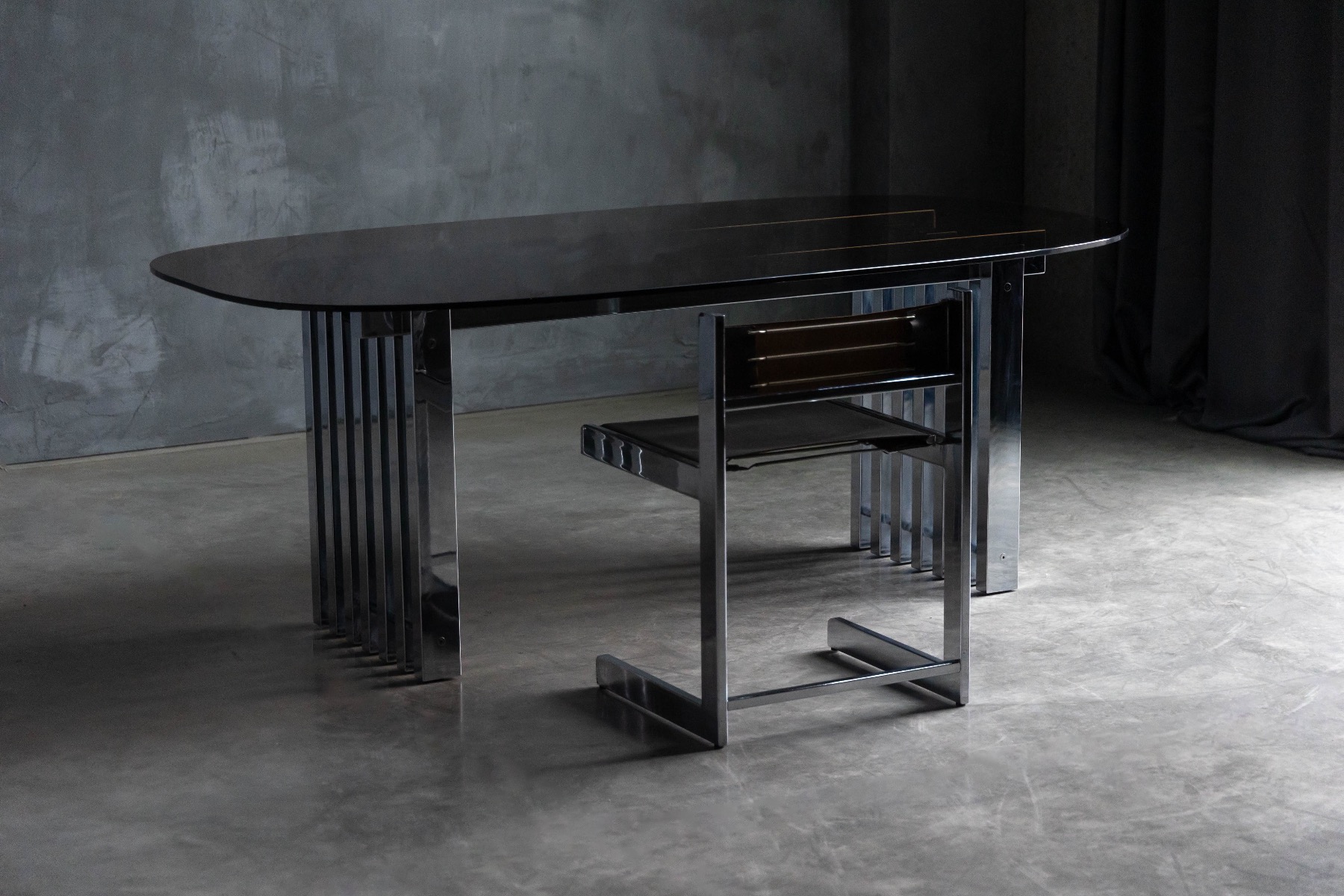 Architectural chrome frame dining table