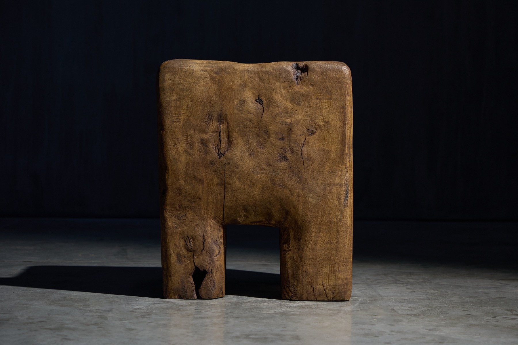 Solid wood hand carved chair with strong silhouette