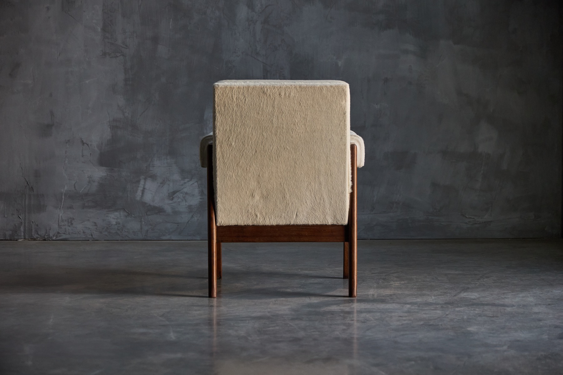 Sculptural modernist bridge armchair with clean lines