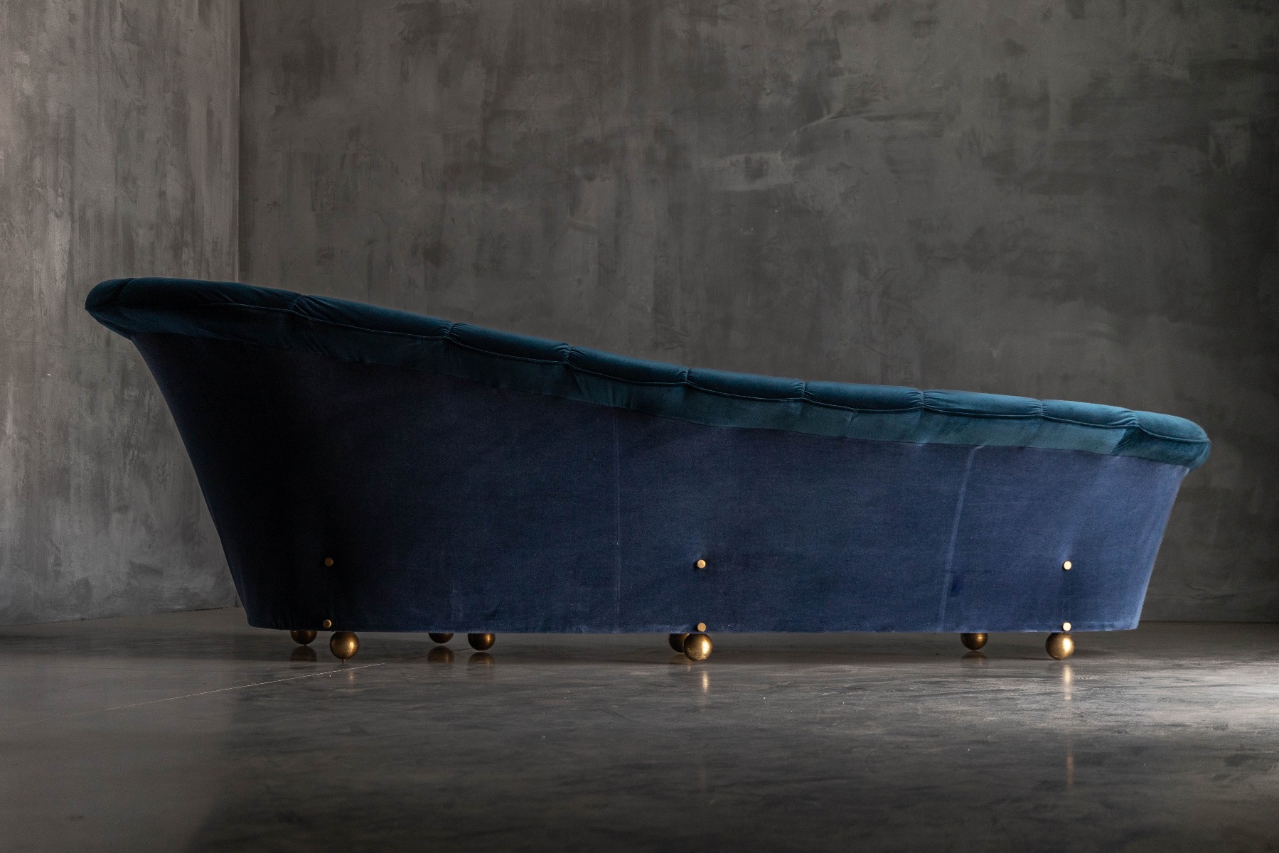 Elegant curved velvet sofa in Hollywood Regency style