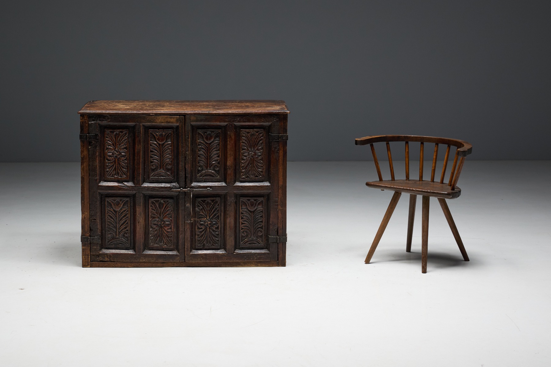 Folk art carved cupboard with traditional ornamentation
