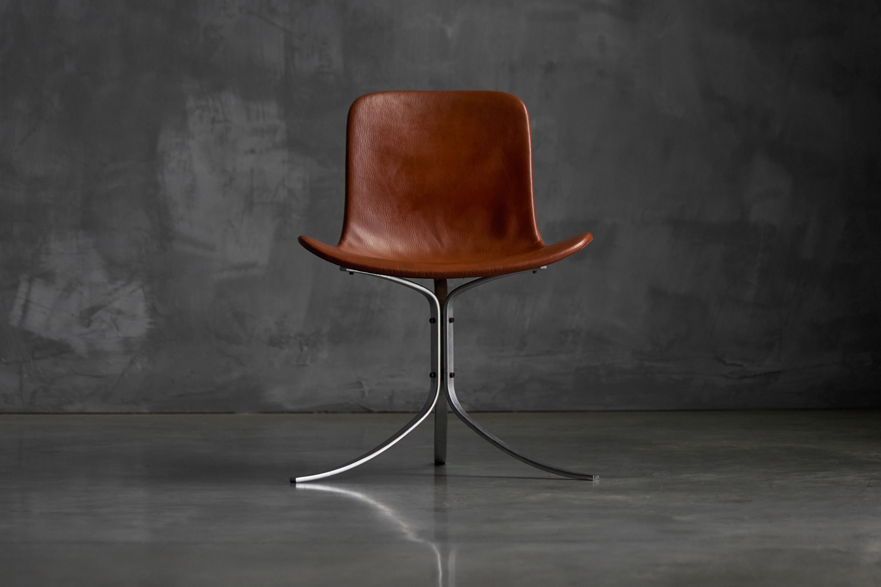 Sculptural PK9 dining chair by Poul Kjærholm