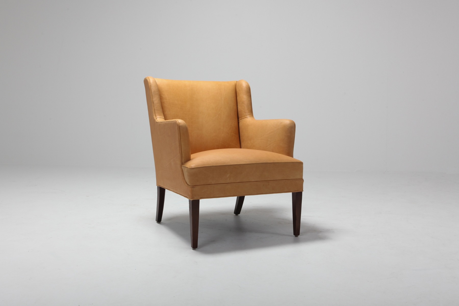 Iconic Scandinavian bergere chairs in camel leather