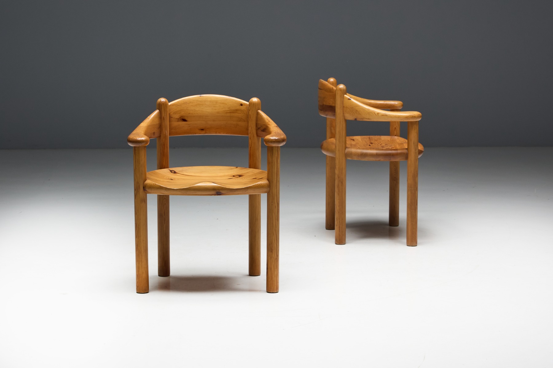 Scandinavian modern pine armchairs with curved design
